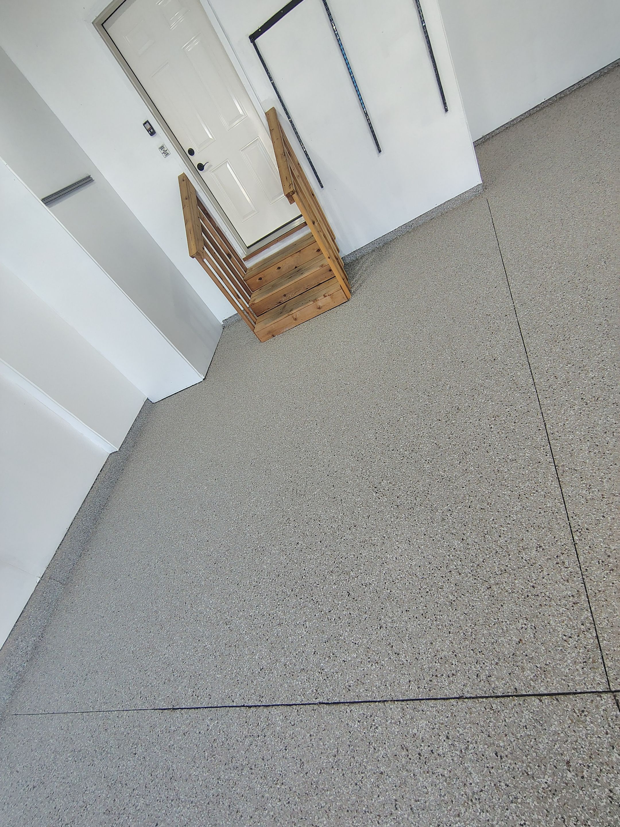 Sioux Falls Garage Floor Transformation With Gray Speckled Epoxy Coating by Select Painting, Coatings & Garage Cabinets