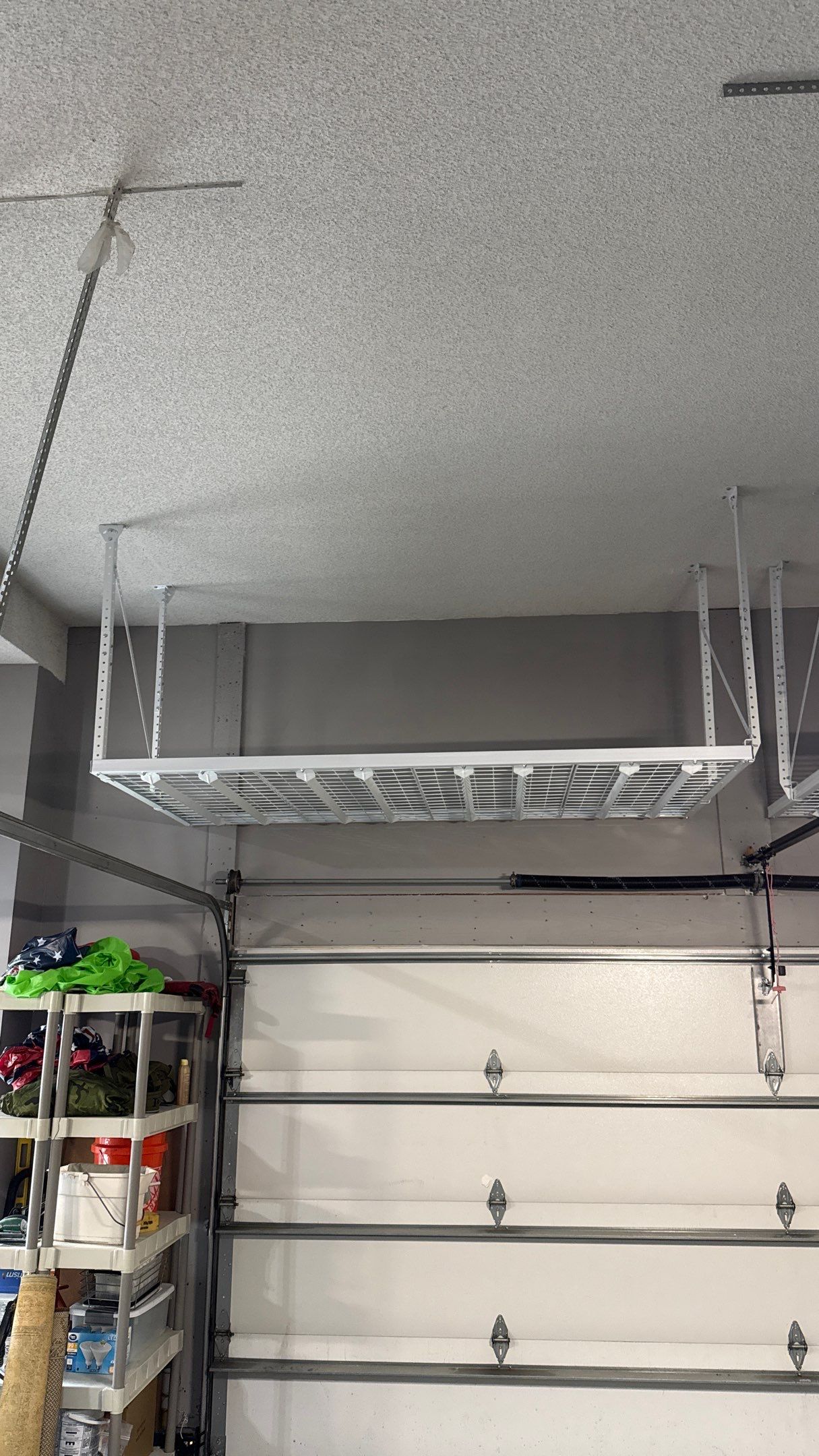 Ceiling Mounted Overhead Storage Rack Installation in Shawnee by Banner Garage