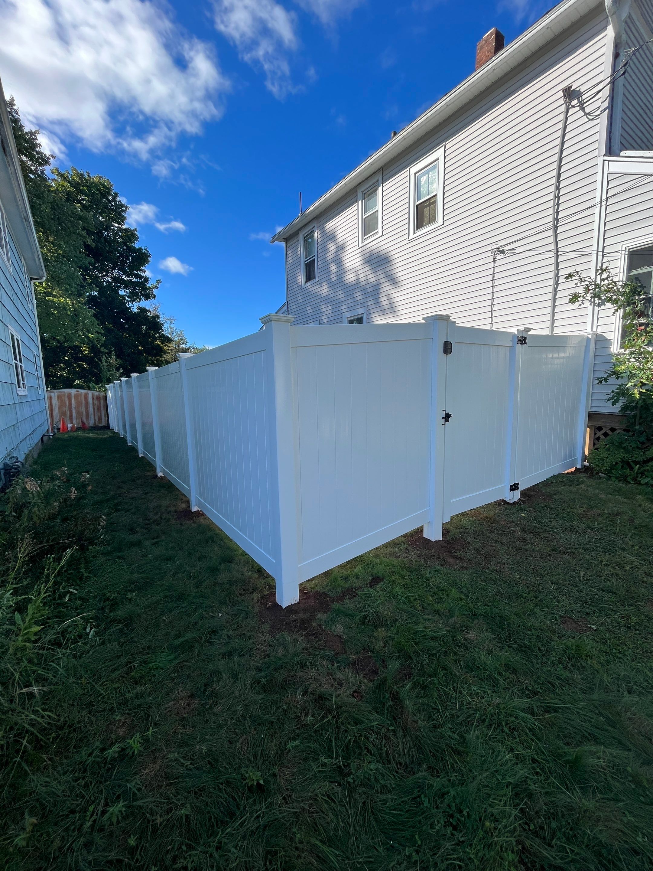 Vinyl Privacy fence with matching gate, White by DiGiorgi Roofing and Siding Inc