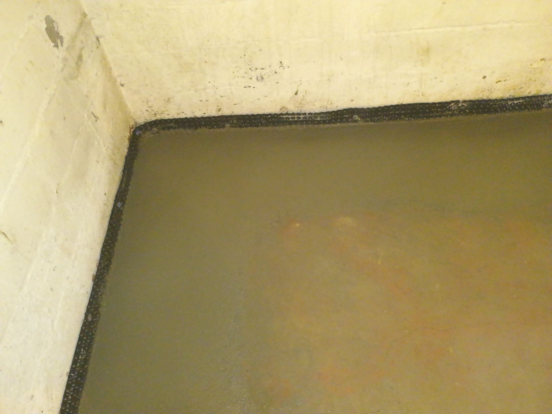 Interior Drain Tile & Sump Pump System in North Minneapolis by Waterproofing Northeast