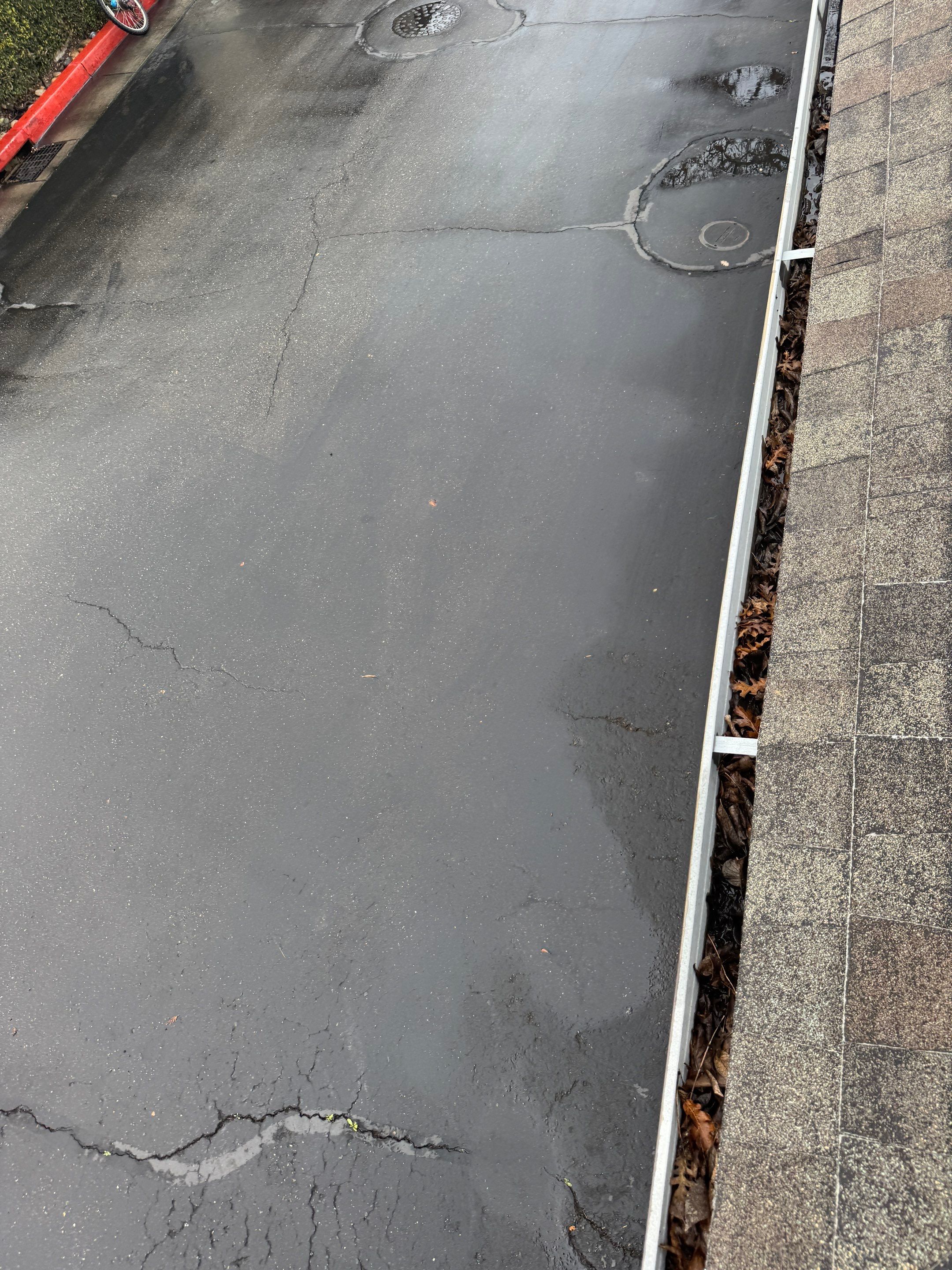 Commercial gutter cleaning Stockton, CA before photo with filled gutters