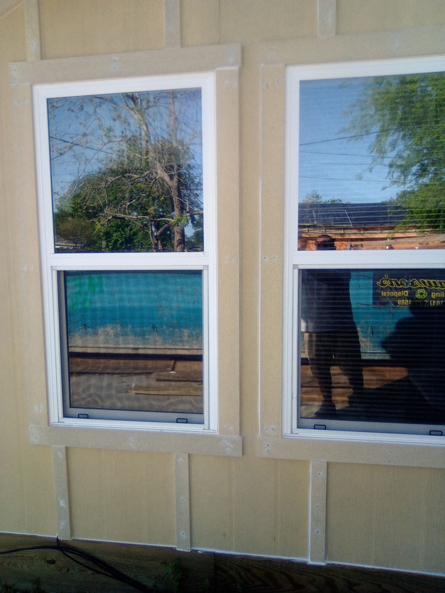 Vinyl to Hardie by Bayfront Roofing and Construction