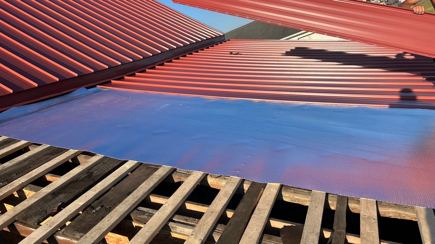 Residential Roofing Installation using Standing Seam Metal - Barn Red by RoofX 