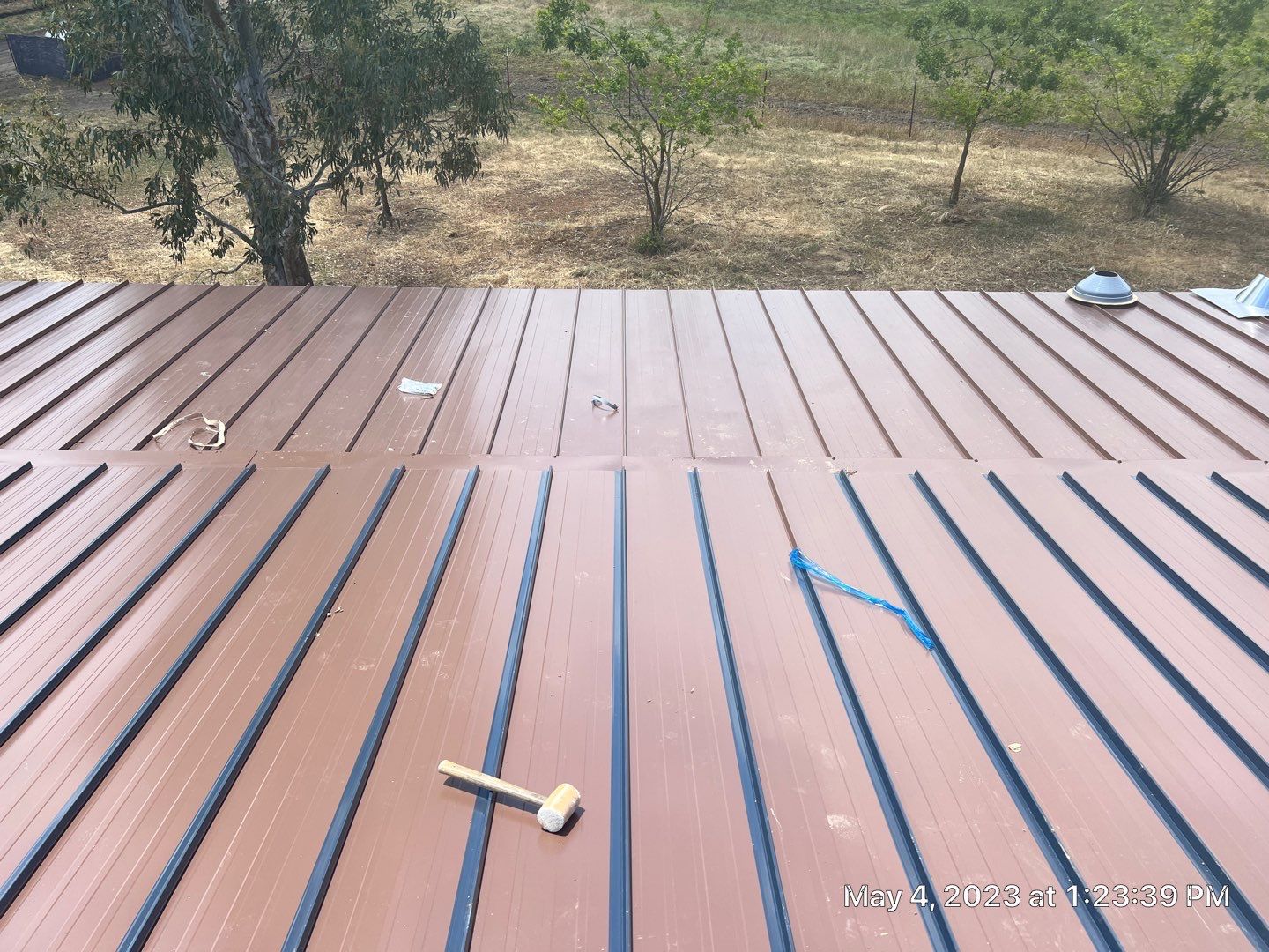 Metal roofing installation using Standing seam metal roofing system by Straight Edge Roofing Inc