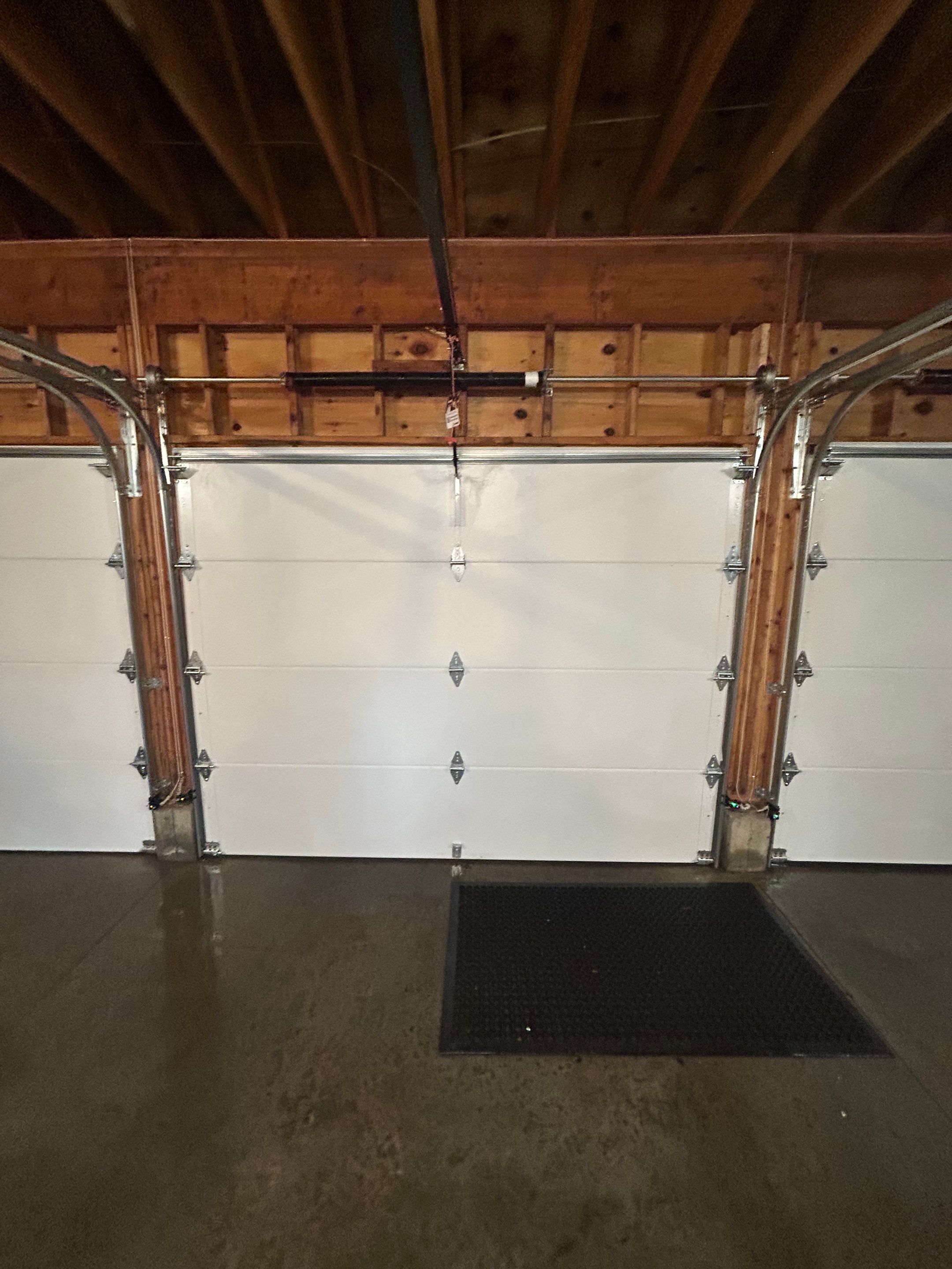 Modern Triple Garage Door Upgrade by DiGiorgi Roofing and Siding Inc