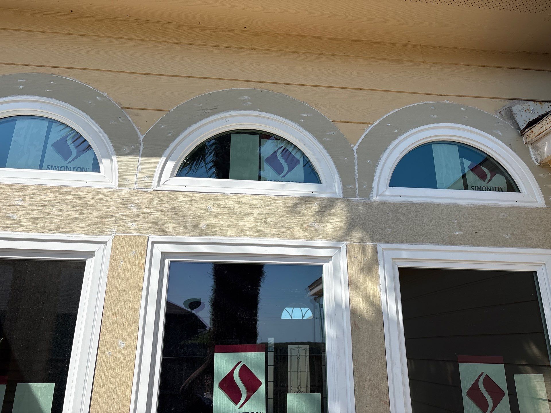 Curved Trim Windows by Bayfront Roofing and Construction