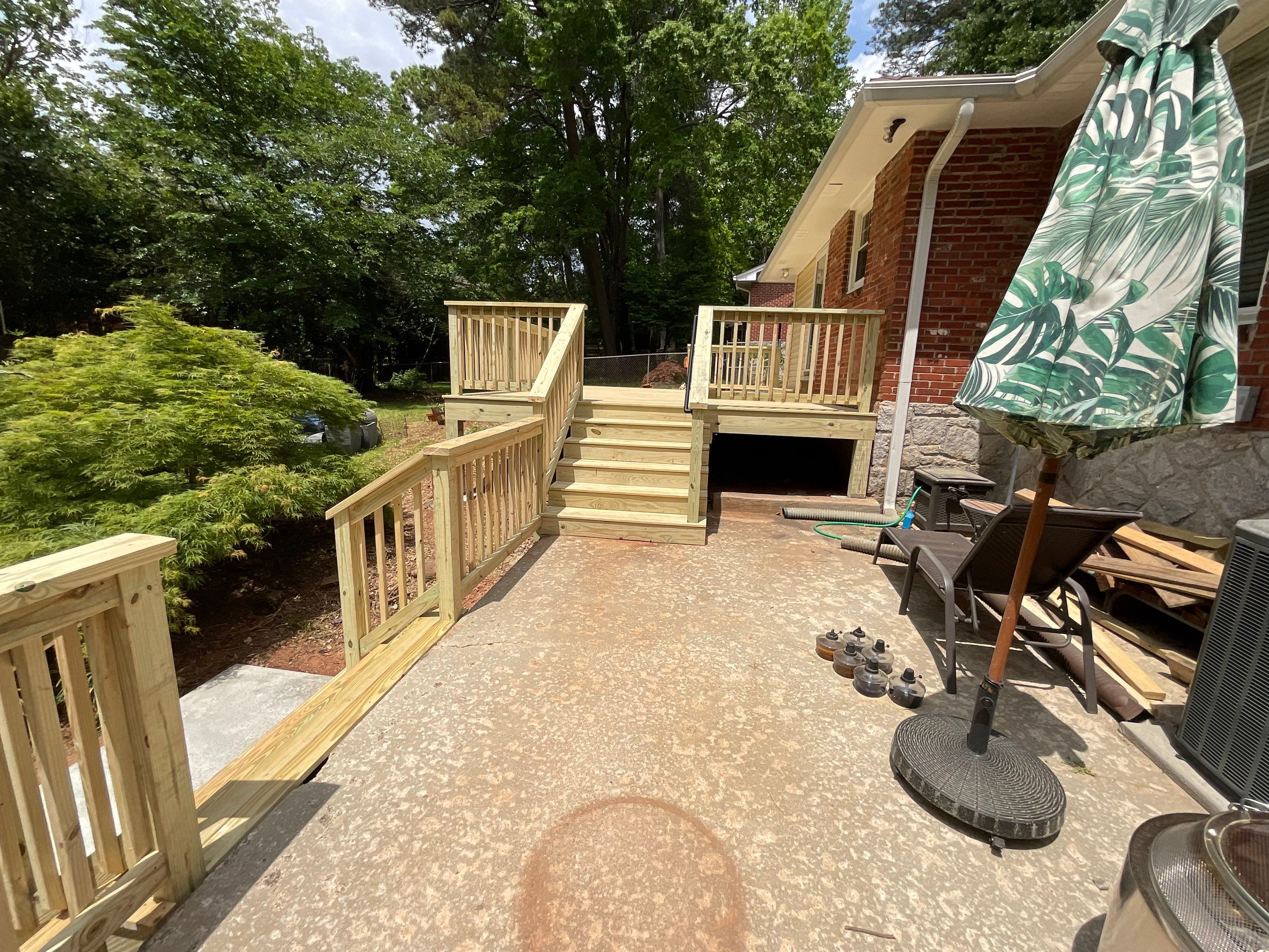 Custom Pressure-Treated Wood Deck and Railing Installation in Decatur by Swift Home Renovations