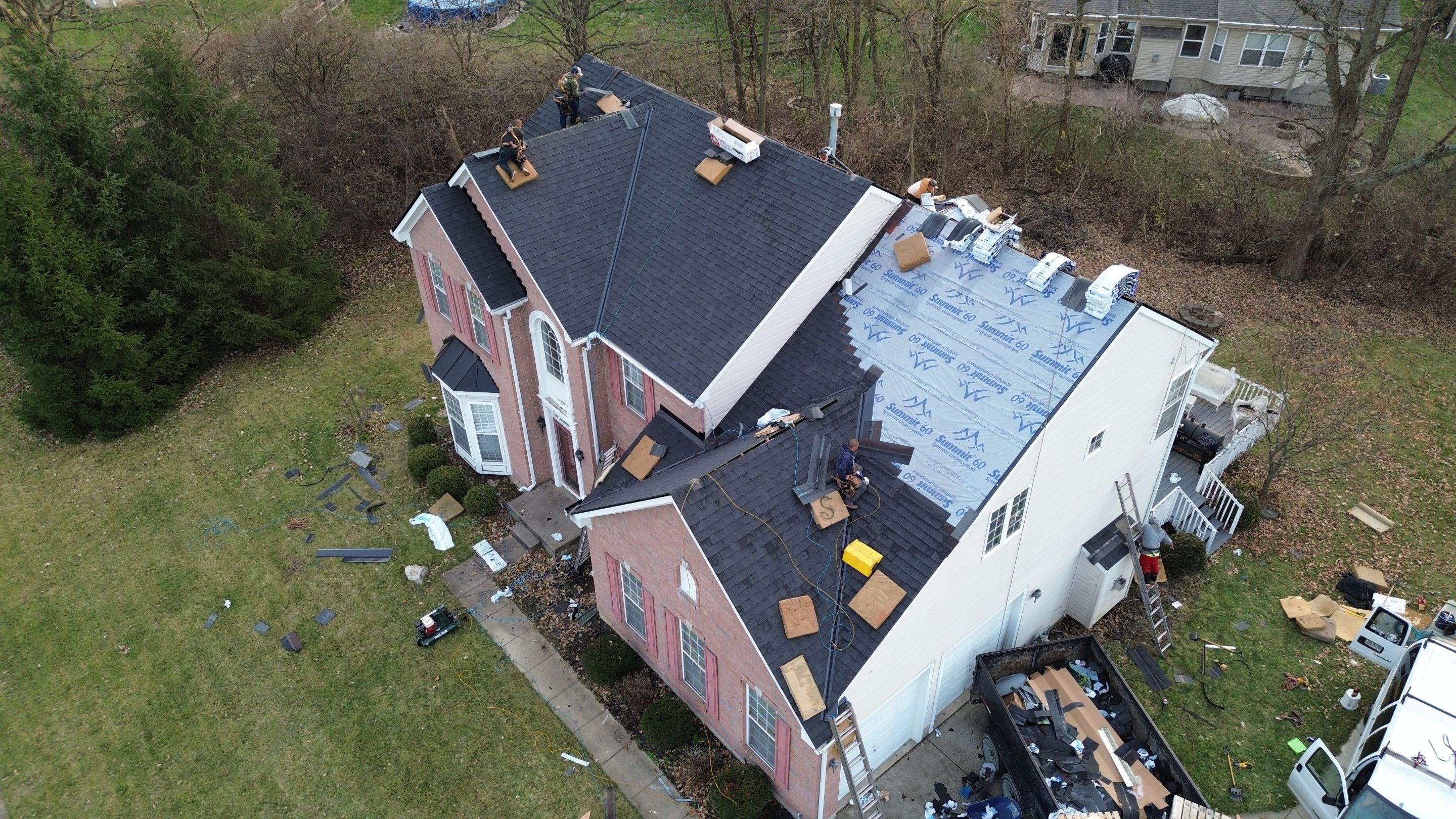 Walden Ponds - Pristine Black and Hydro Flo Gutter Guards by Tamlin Roofing