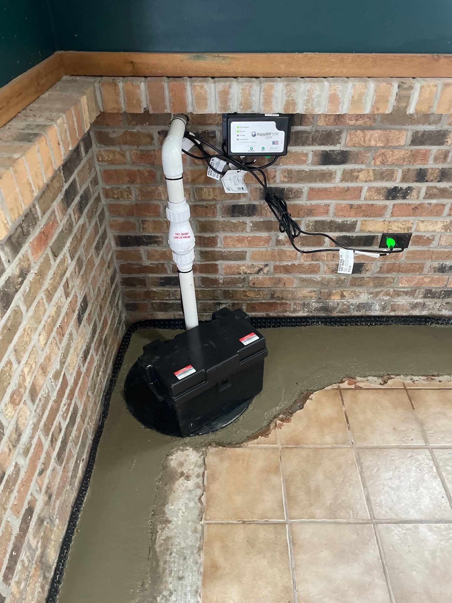 Interior Drain Tile System in Elwood by Area Wide Waterproofing