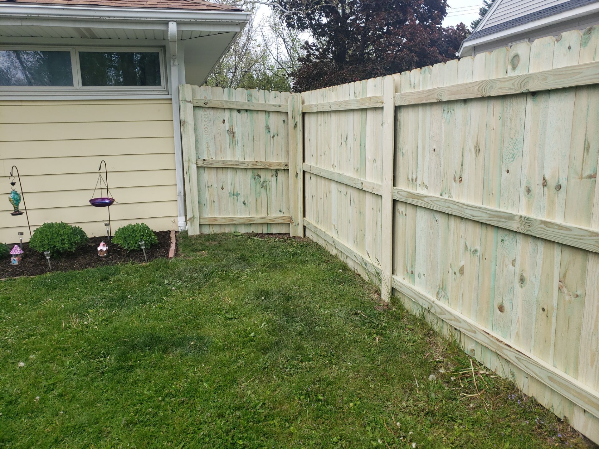 Pressure-Treated Wood Privacy Fence Installation in Waterloo by Perfect Picket Fence and Stain