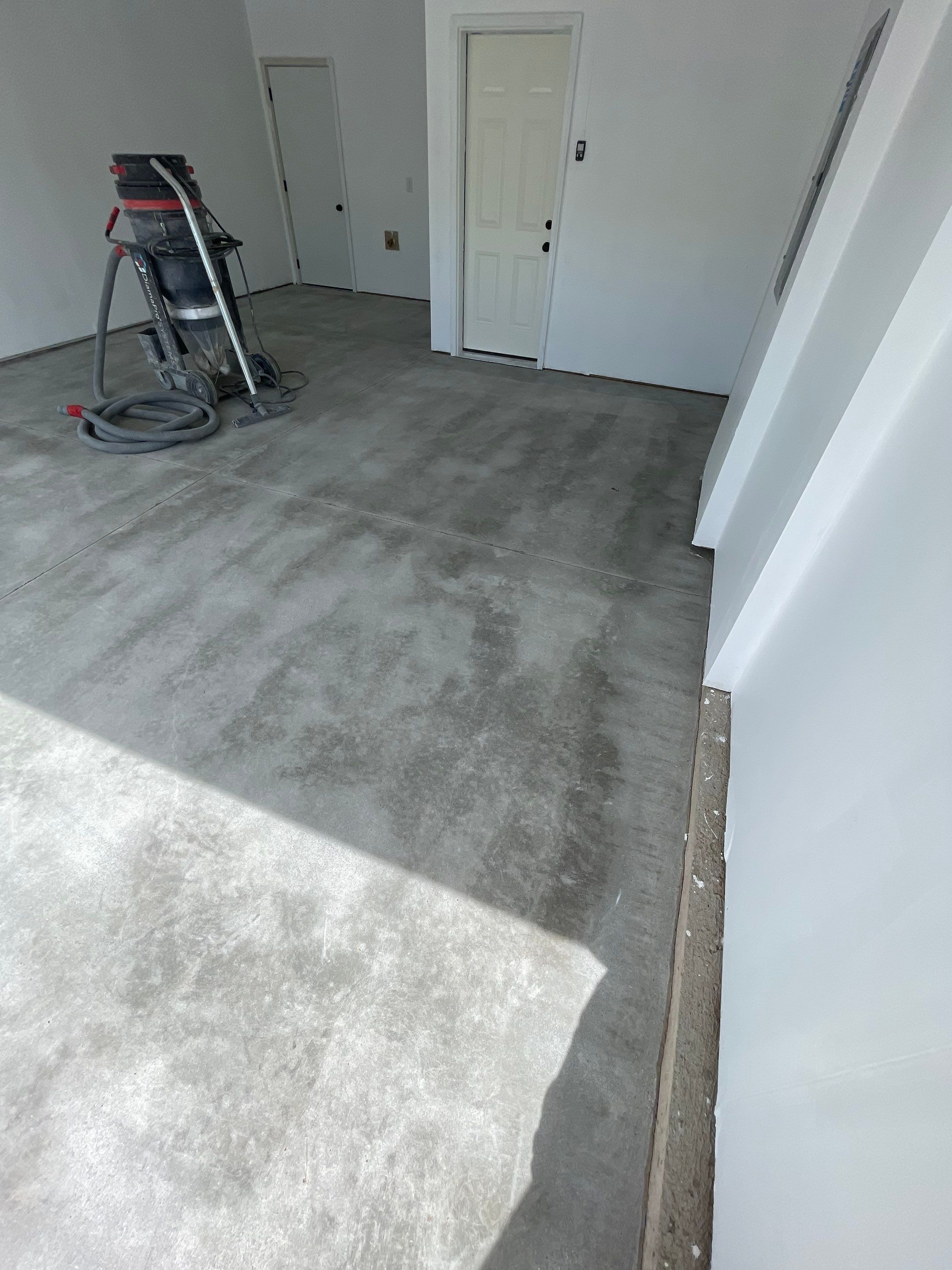 Sioux Falls Garage Floor Transformation with Cabin Fever Decorative Chips by Select Painting, Coatings & Garage Cabinets