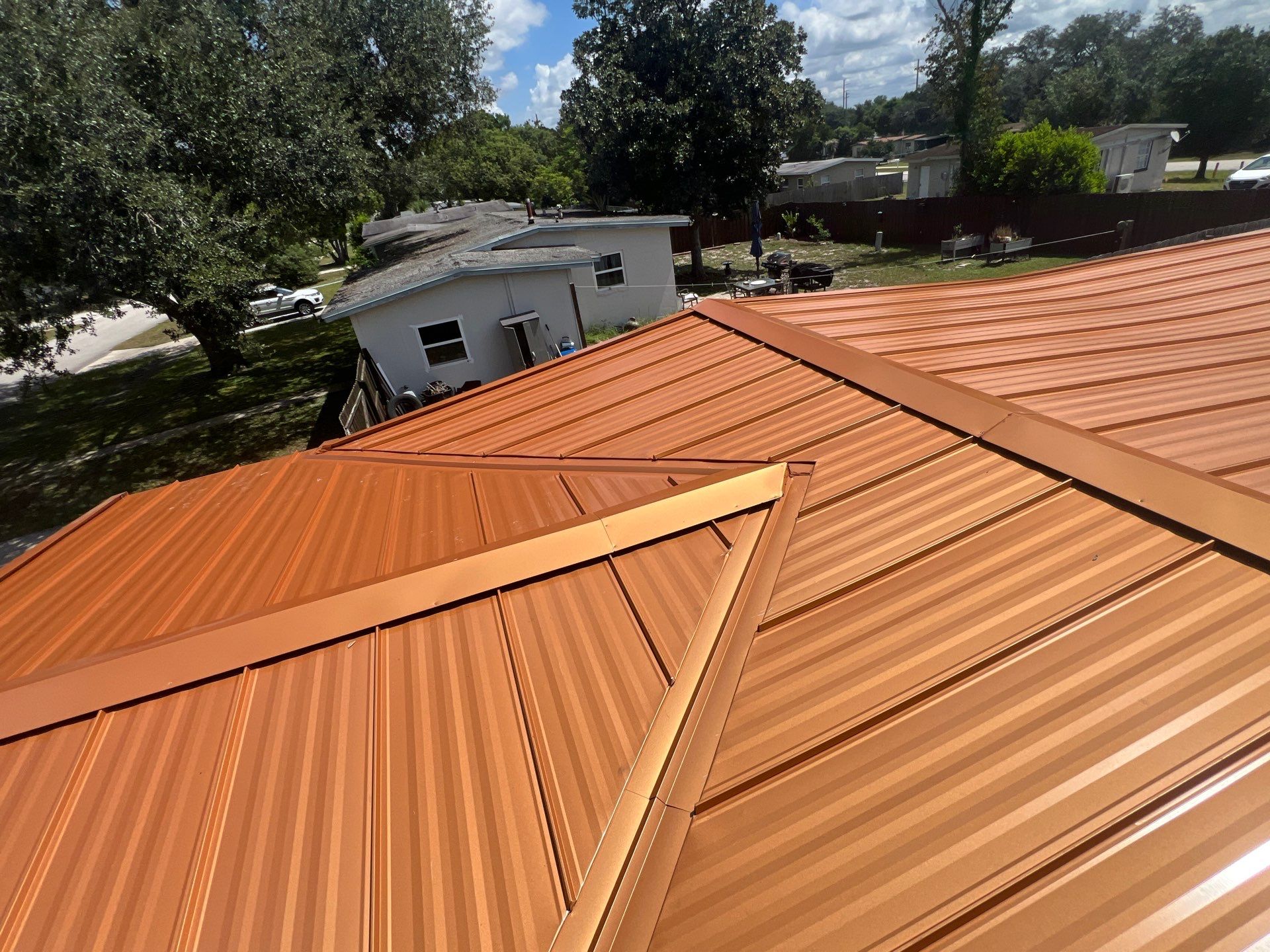 Standing Seam Metallic Copper Metal Roof Replacement in Deltona by Pinnacle Roofing Group