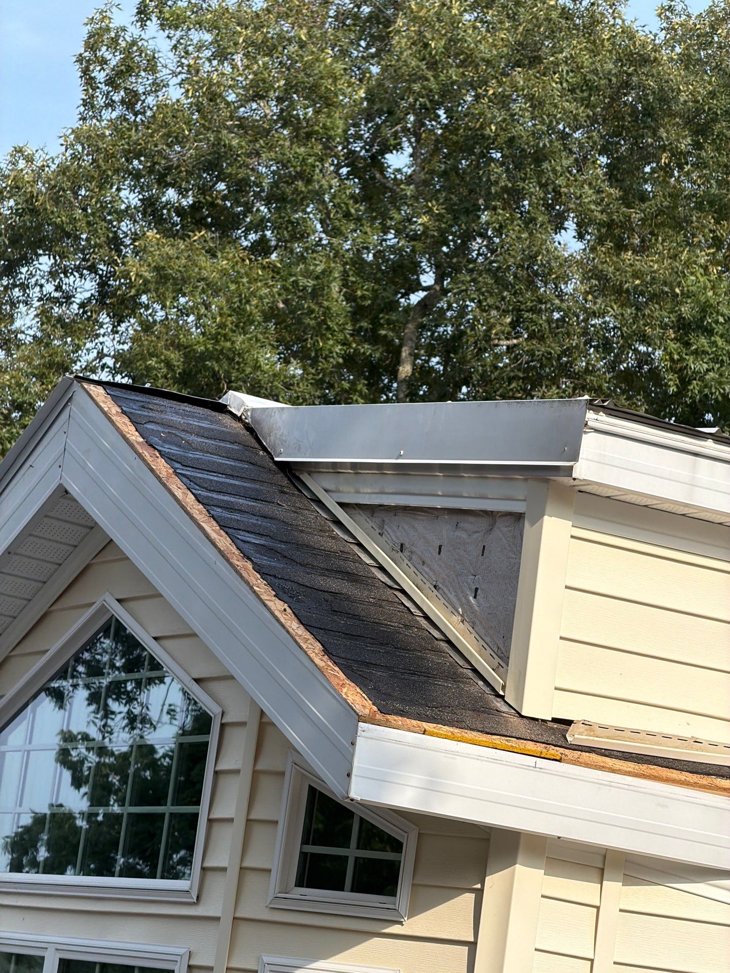 White Standing Seam Metal Roof Installation in Wake, VA by Cade Construction