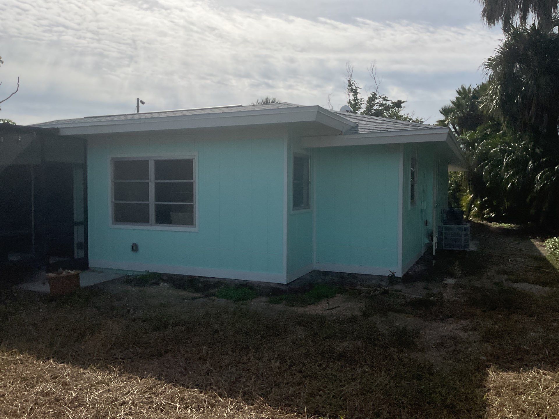 White Seamless Gutters Installation in Sanibel FL by Gutter Professors