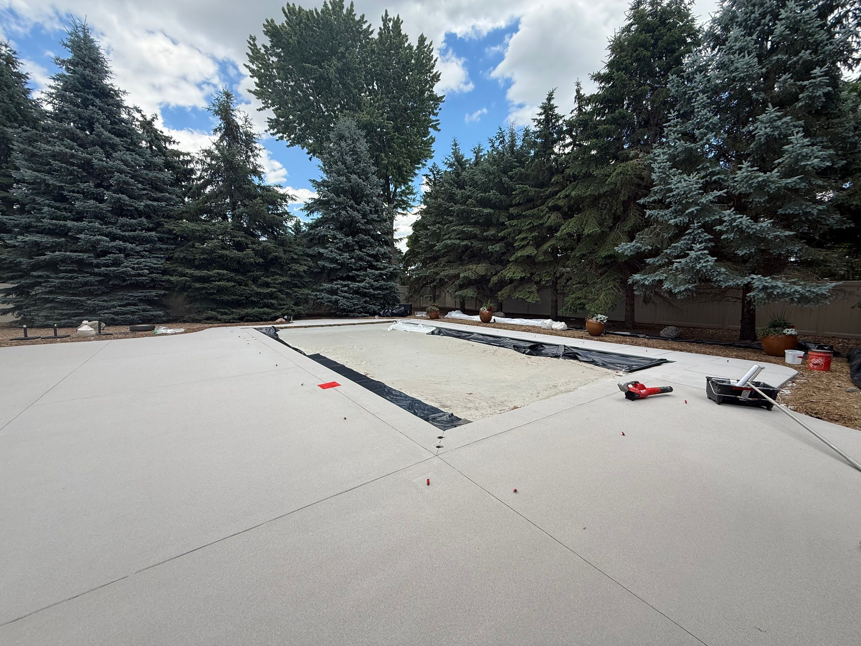 Decorative Concrete Pool Deck and Patio Resurfacing in Sioux Falls by Select Painting, Coatings & Garage Cabinets