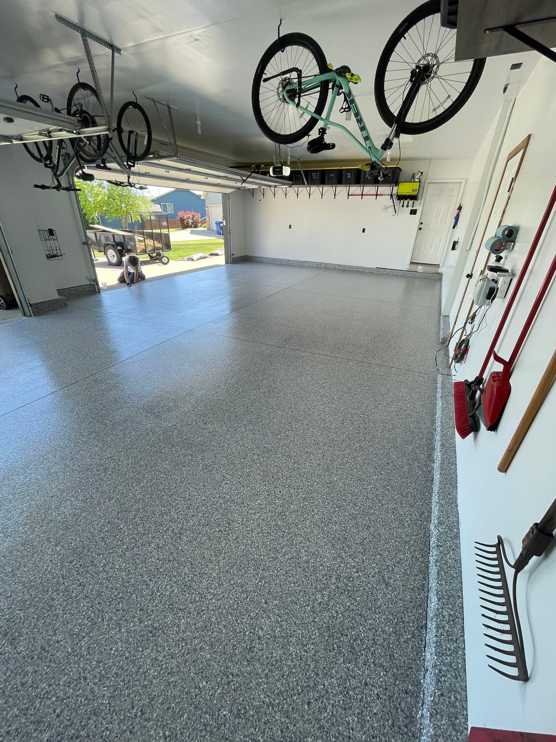 Tidal Wave Flake Garage Floor Installation in Sioux Falls by Select Painting, Coatings & Garage Cabinets