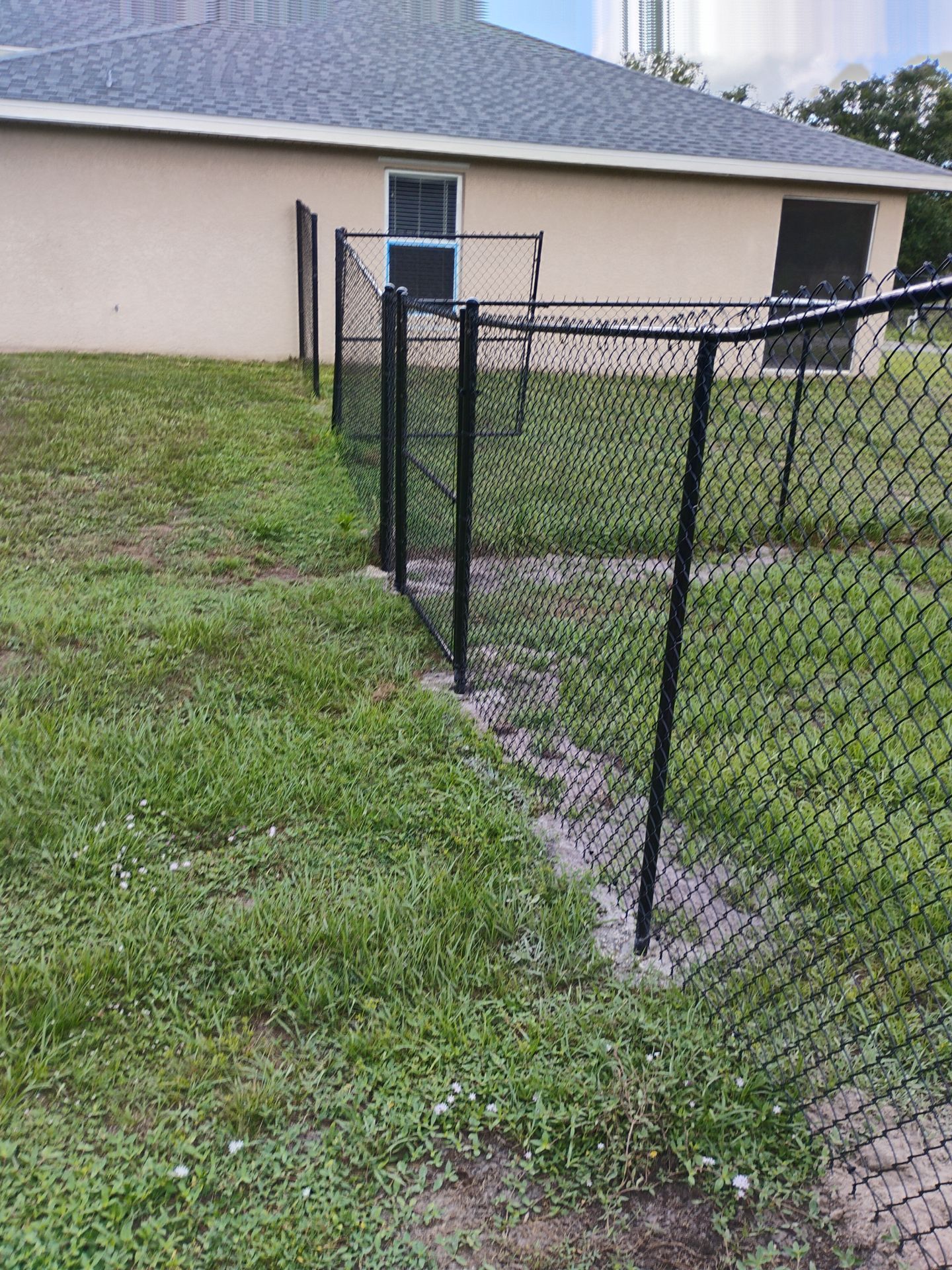 Black Chain Link and Vinyl Privacy Fence Installation in North Port by True Fence LLC