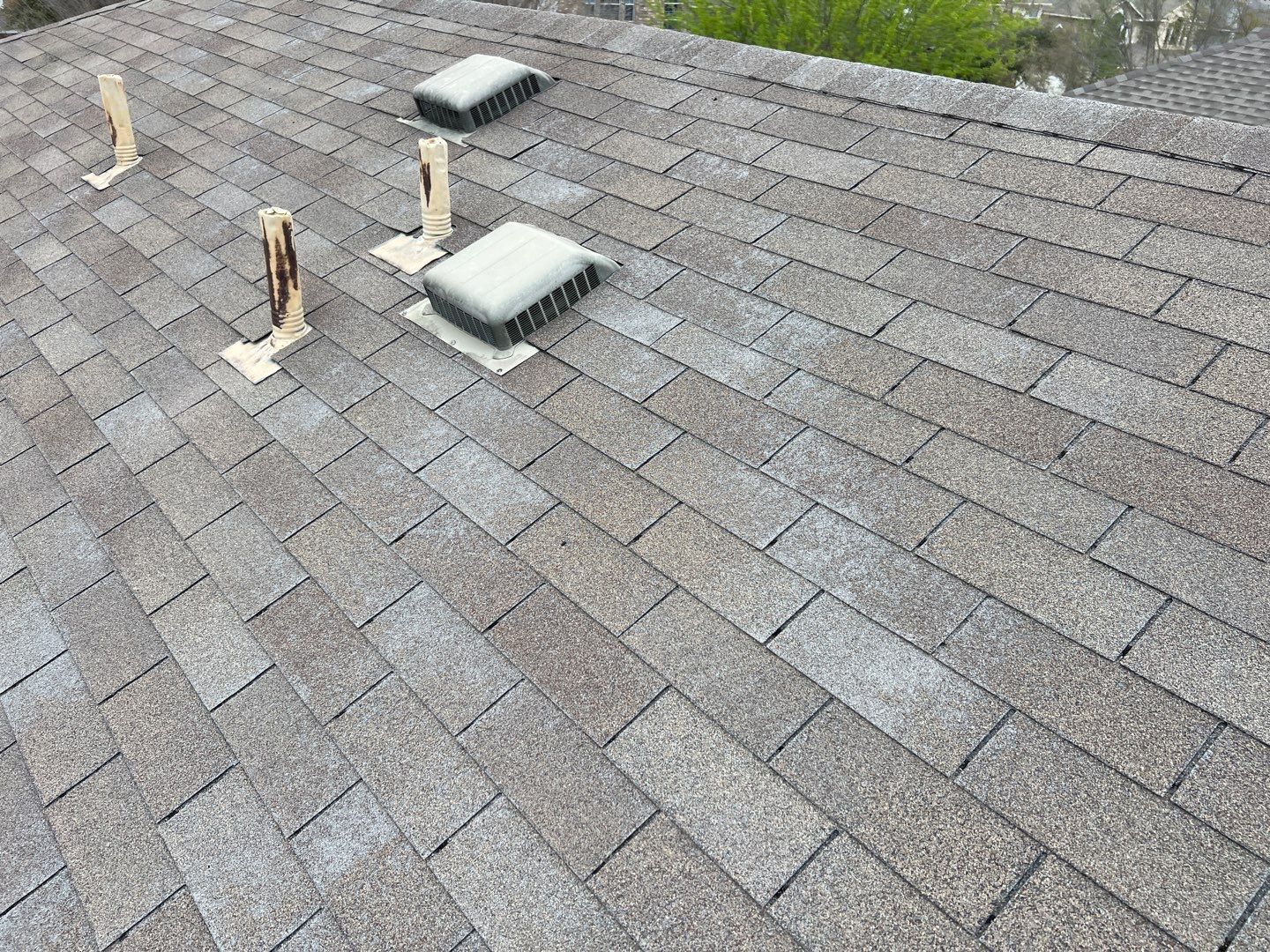Wind damaged roof replacement by Oakwood Roofing and Construction, LLC