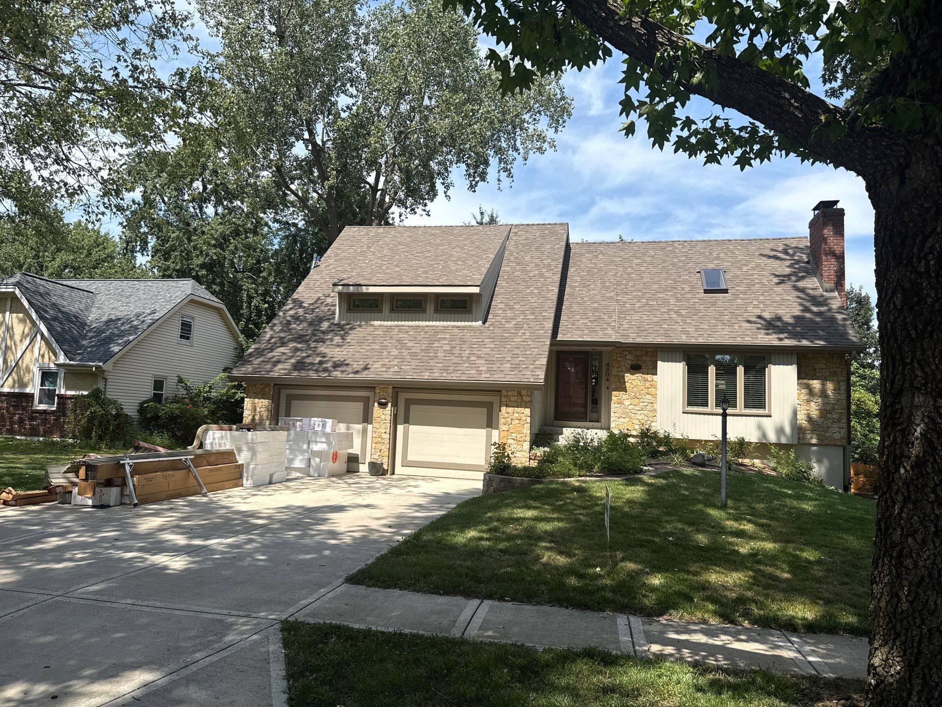 Comprehensive Kansas City Exterior Remodel Featuring Board And Batten Siding by EEC Windows, Siding & Roofing