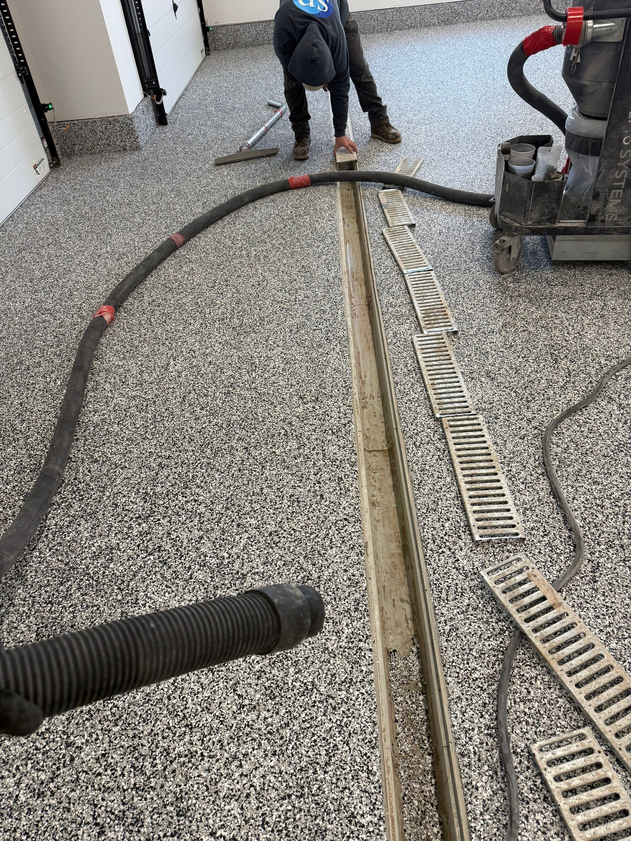 Multi-Car Garage Epoxy Floor Coating and Concrete Finishing in Sioux Falls by Select Painting, Coatings & Garage Cabinets