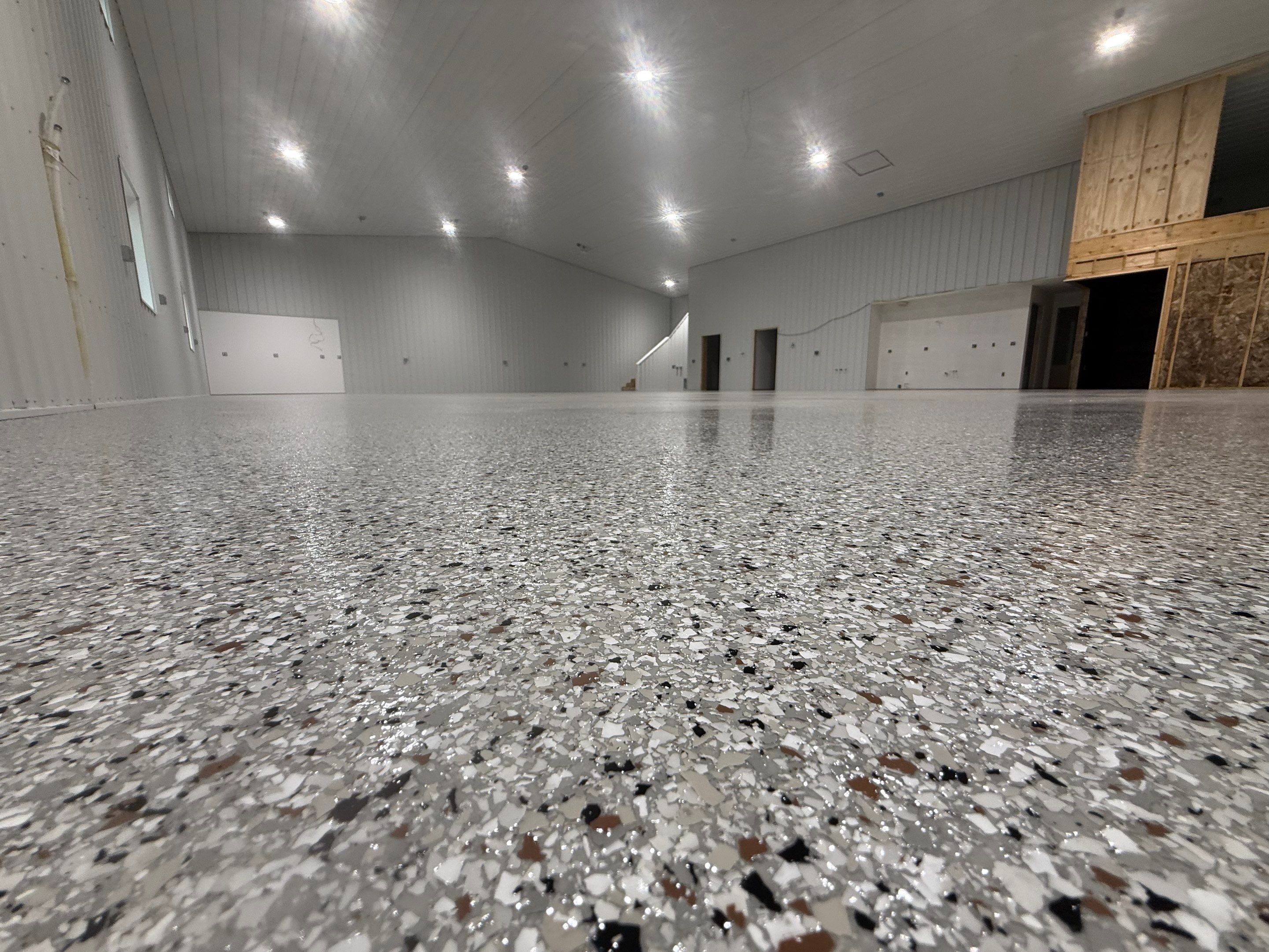 Custom Speckled Floor Coating for Large Montrose Shop by Select Painting, Coatings & Garage Cabinets