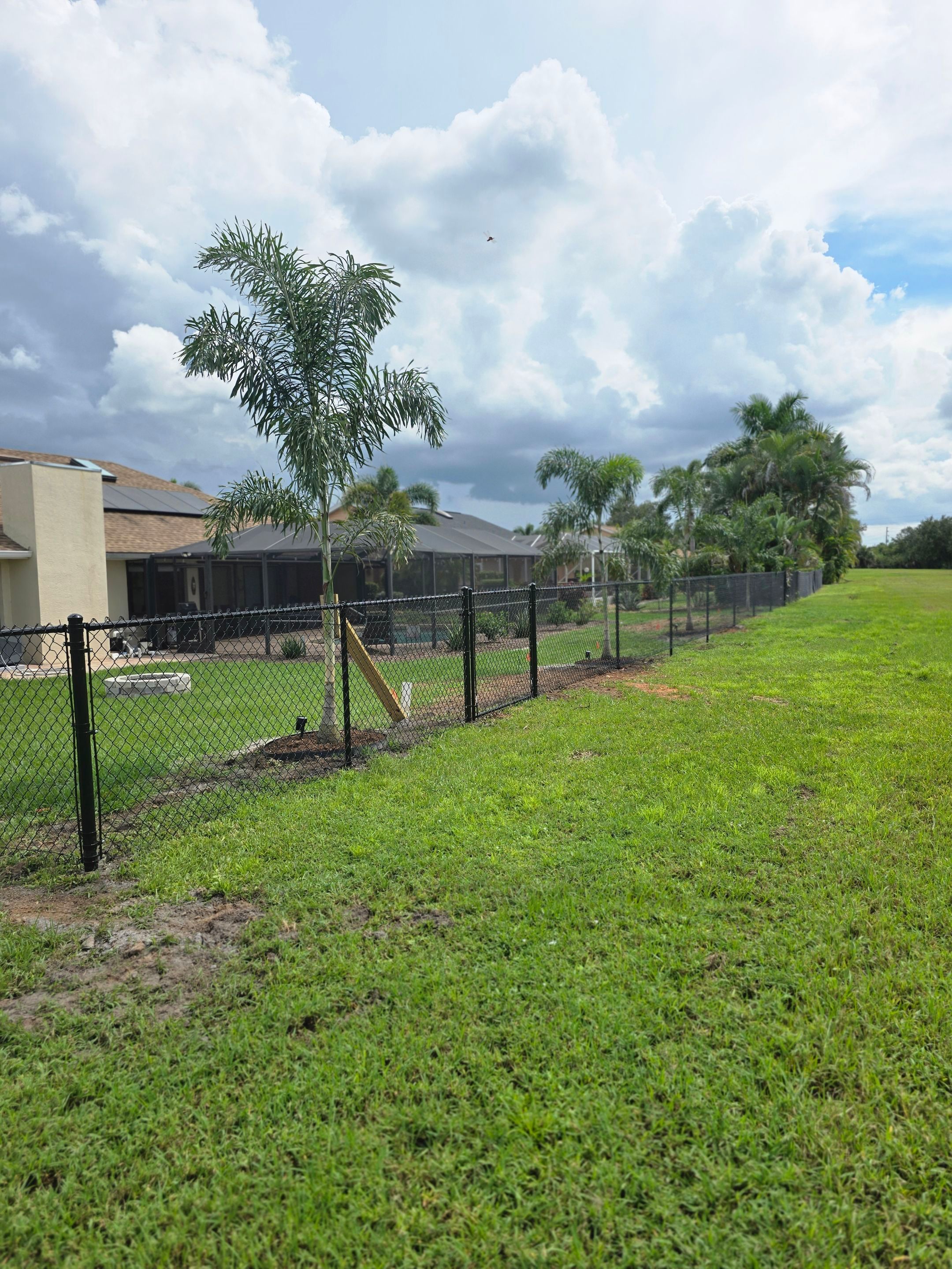 Black Vinyl-Coated Chain Link Fence Installation in Punta Gorda by True Fence LLC