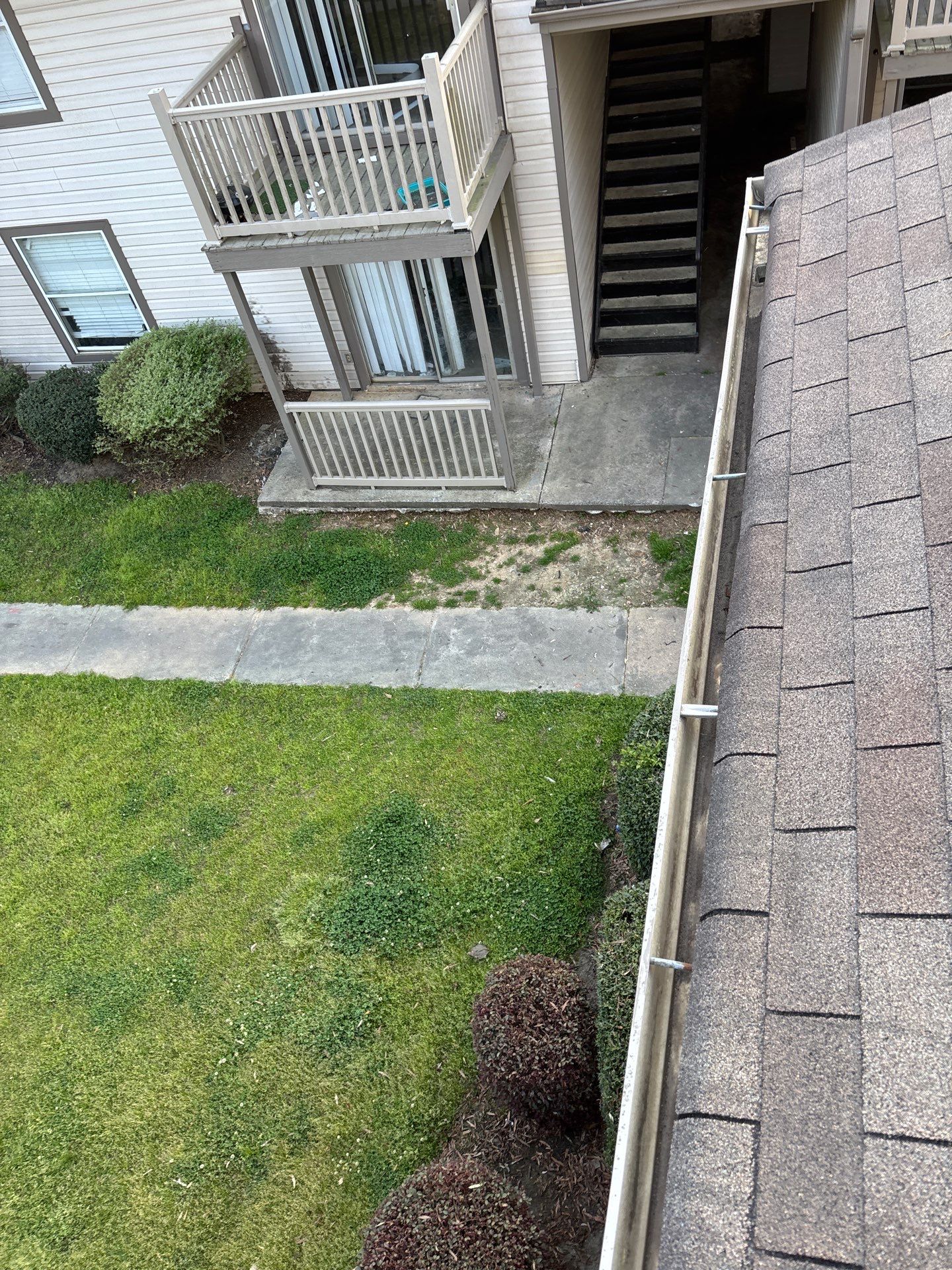 HOA gutter cleaning in Peachtree City, GA, after  photo showing full gutters.