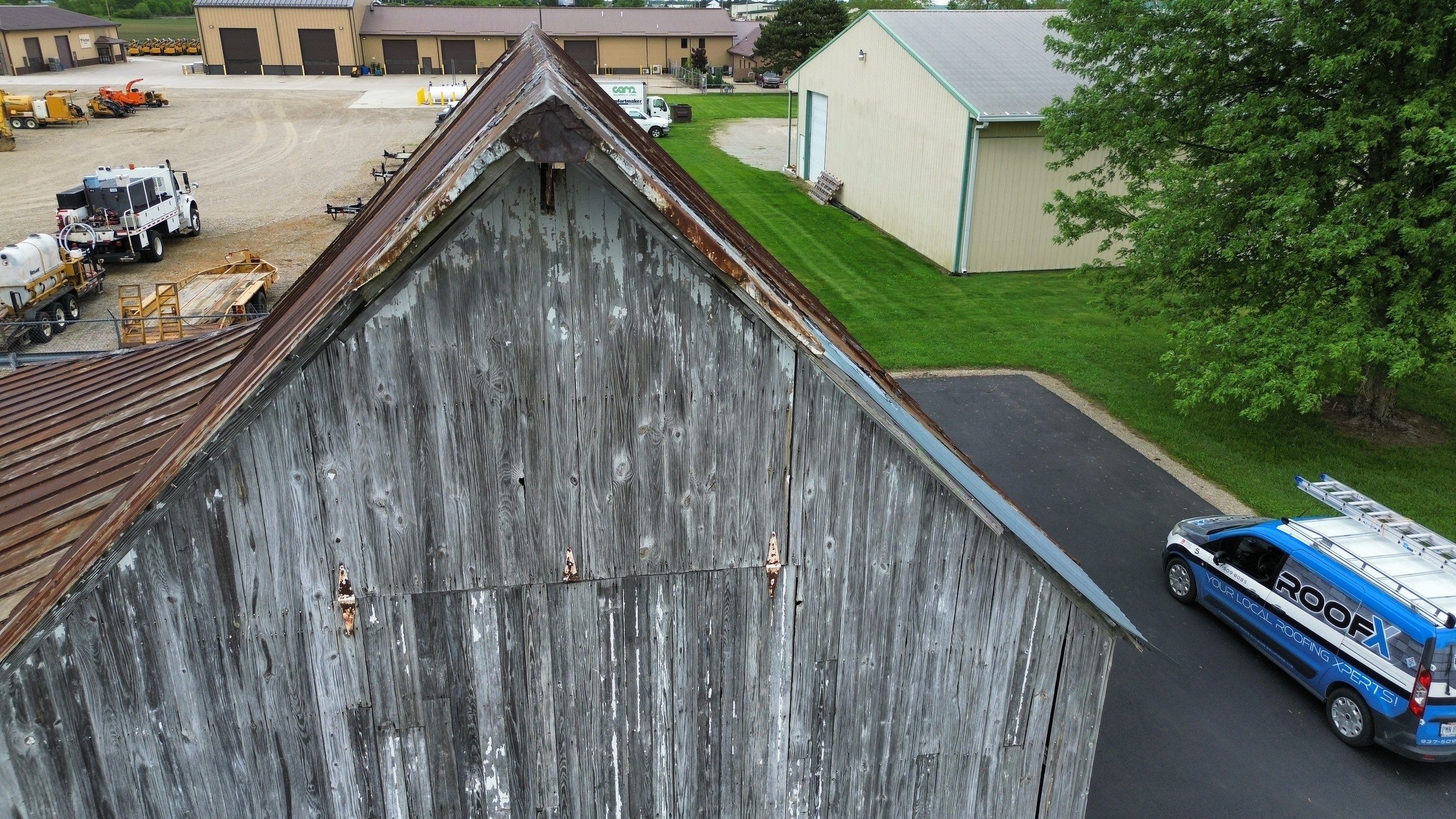 Residential Roofing Installation using Standing Seam Metal - Barn Red by RoofX 