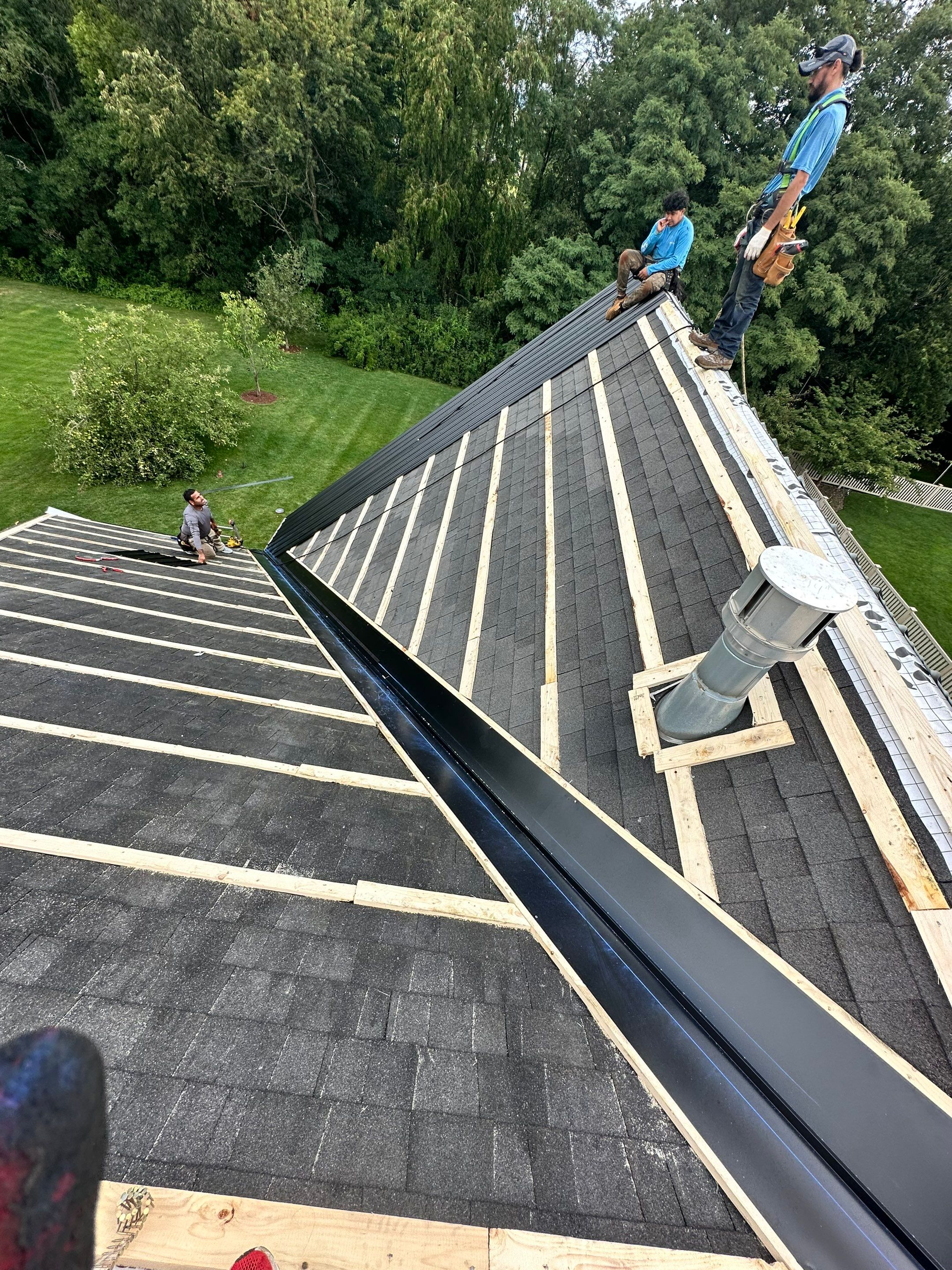 Standing seam / Azm panel in black  by Teflon Roofing