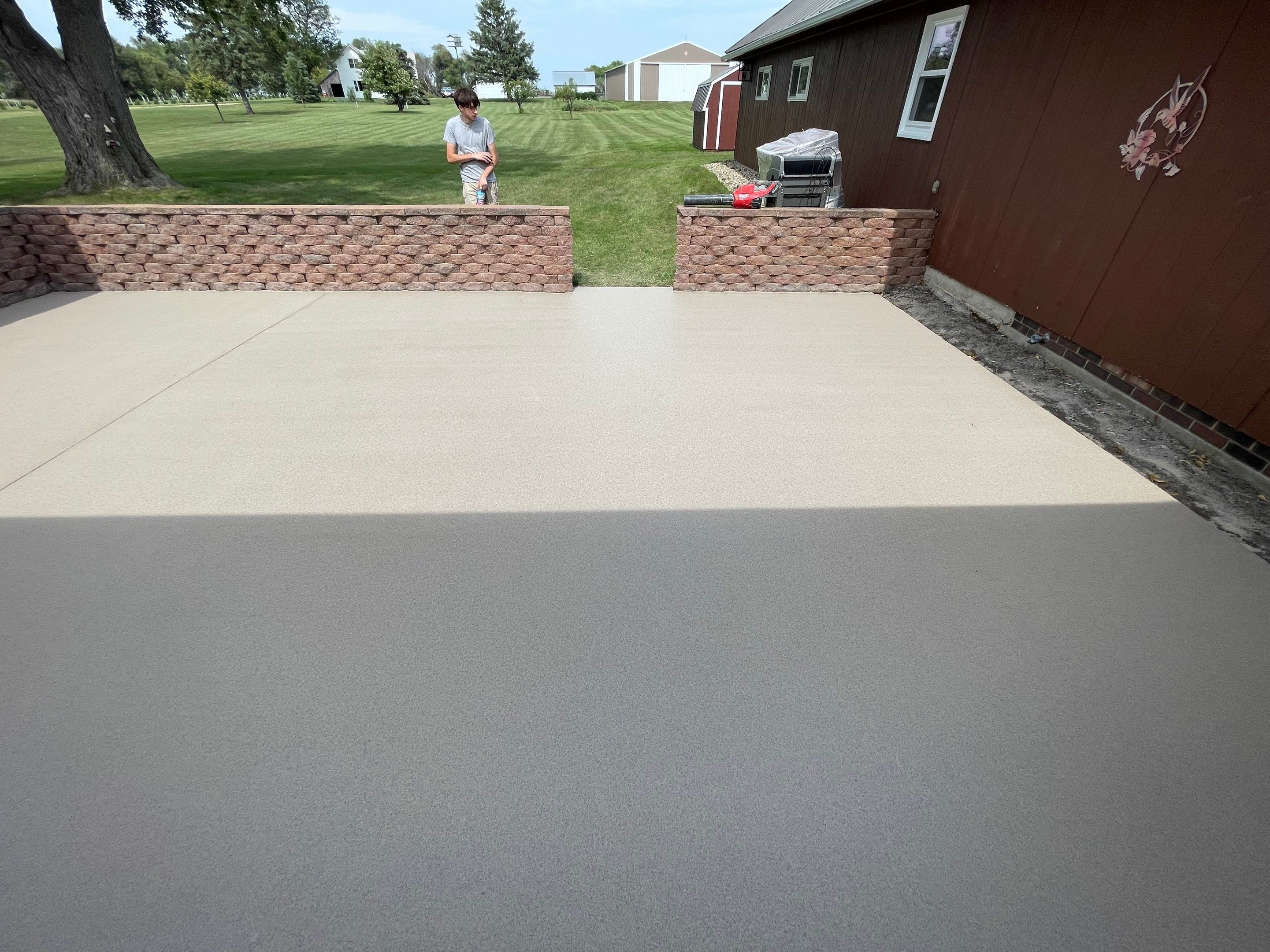 Concrete Patio Resurfacing and Protective Coating in Winfred, South Dakota by Select Painting, Coatings & Garage Cabinets