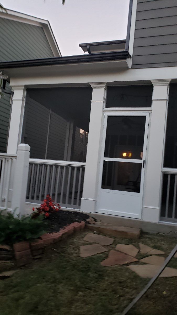 Custom Screened-In Porch Enclosure with White Railings in Smyrna by Swift Home Renovations
