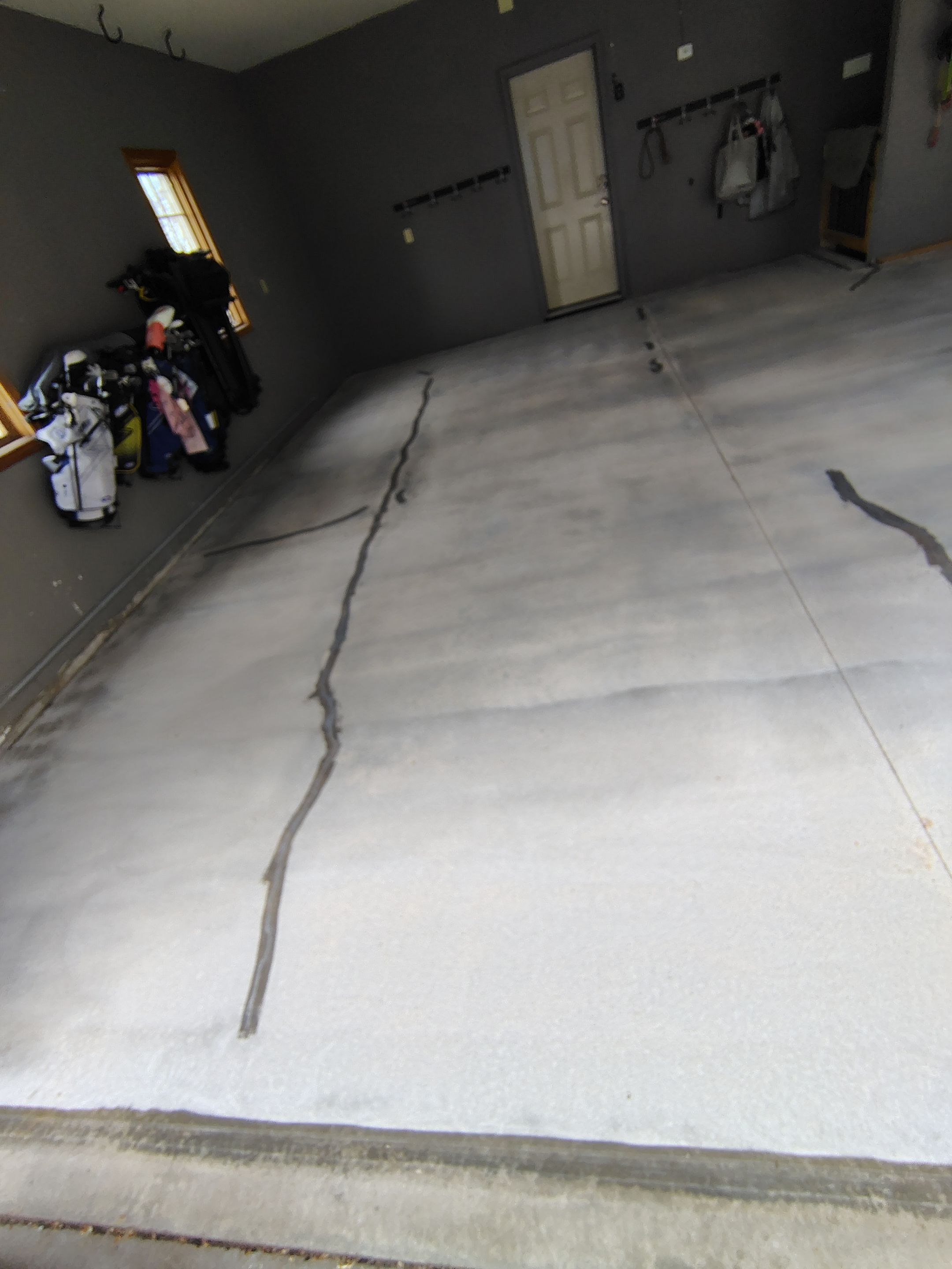 Garage Floor Concrete Coating and Crack Repair in Sioux Falls by Select Painting, Coatings & Garage Cabinets