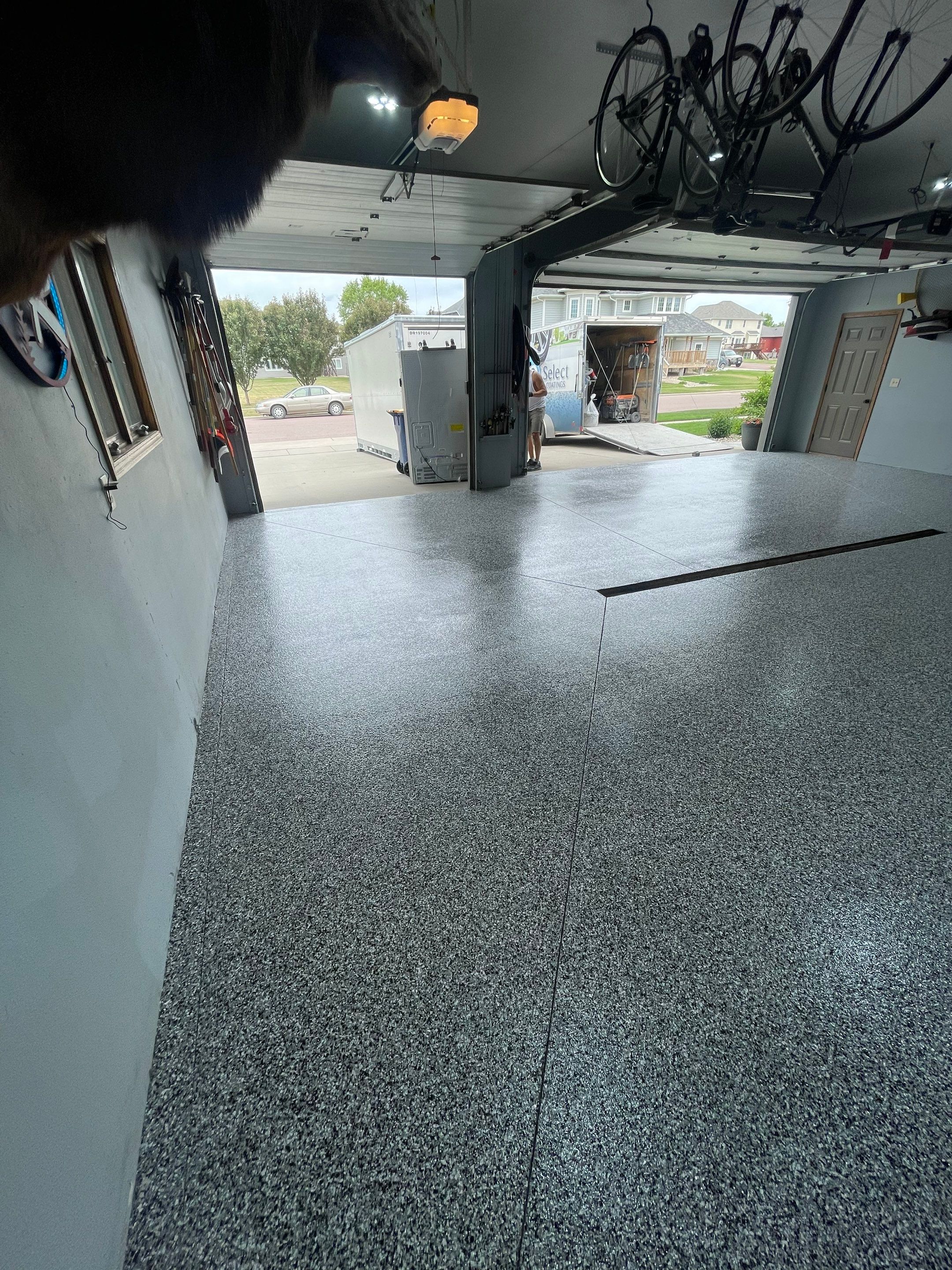 Full Garage Floor Epoxy Coating Installation in Dell Rapids by Select Painting, Coatings & Garage Cabinets