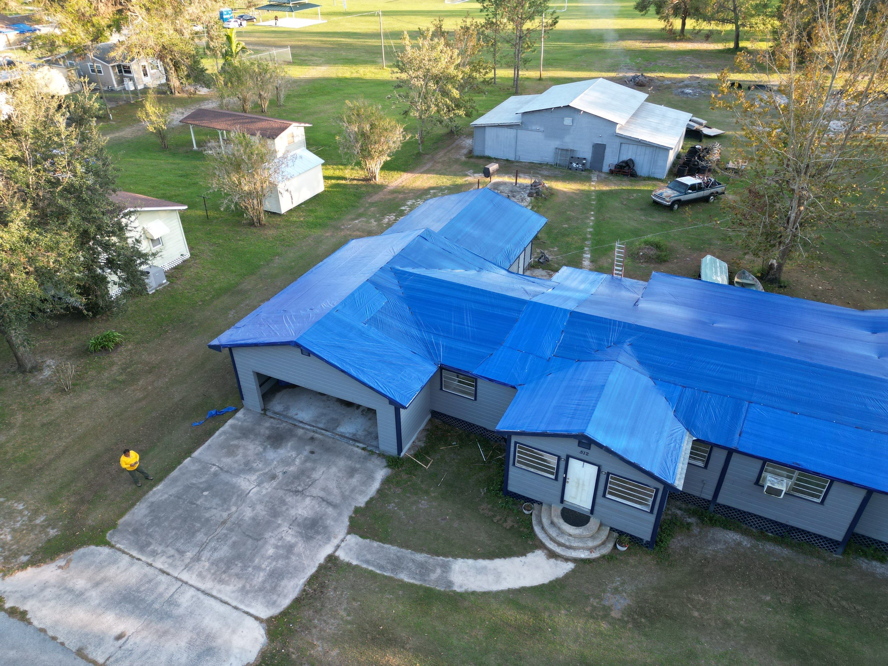 Tarp using TARP BLUE by AquaShield Restoration USA