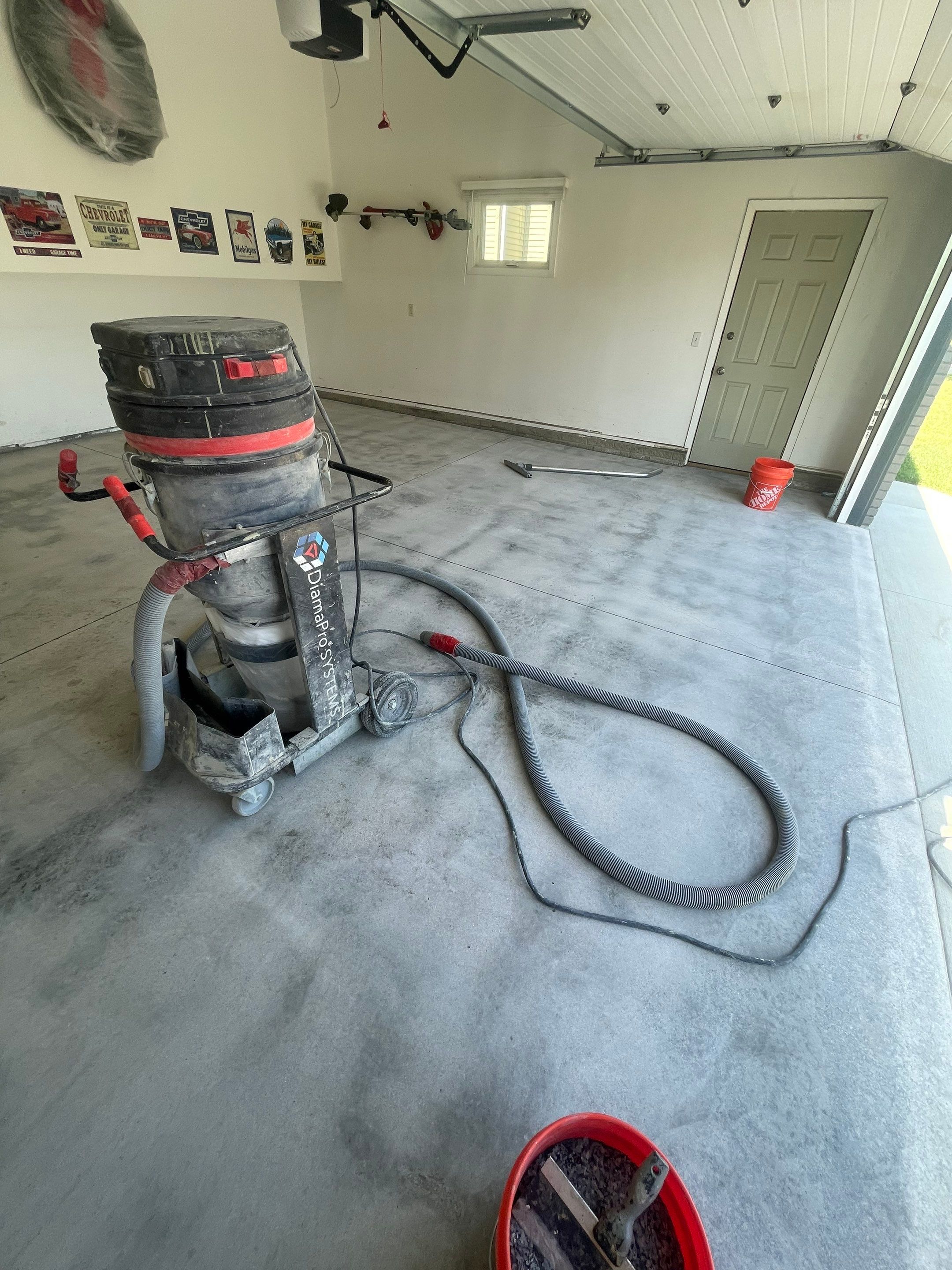 Sioux Falls Garage Floor Coating with Nightfall Decorative Chips by Select Painting, Coatings & Garage Cabinets