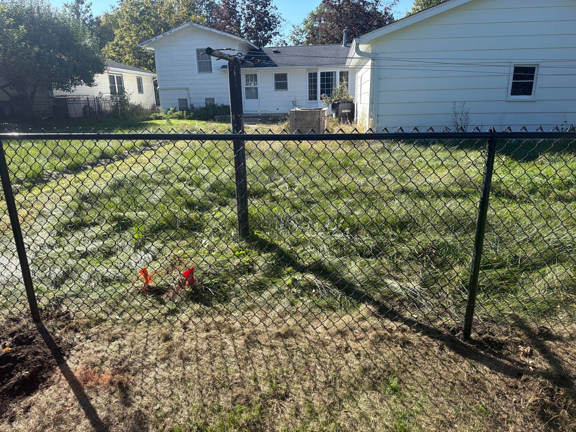 Black Chain Link Fence Installation with Double Gate in Cedar Falls by Perfect Picket Fence and Stain