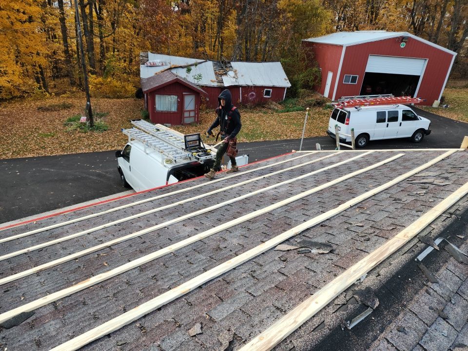 Residential Roof Installation with Red Pro Rib Metal Roofing in Adell, WI by Gellings Roofing and Siding LLC