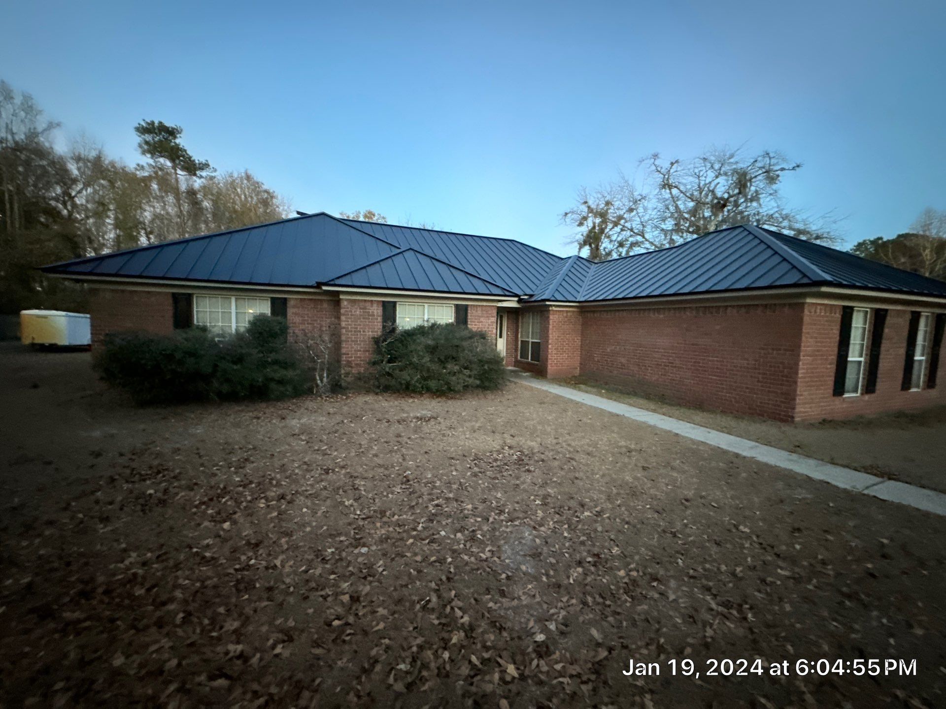 Residential Roofing Installation using Benton 26Ga 1inc Snapcock Metal Roof KYNAR Matte Black by Talya Roofing