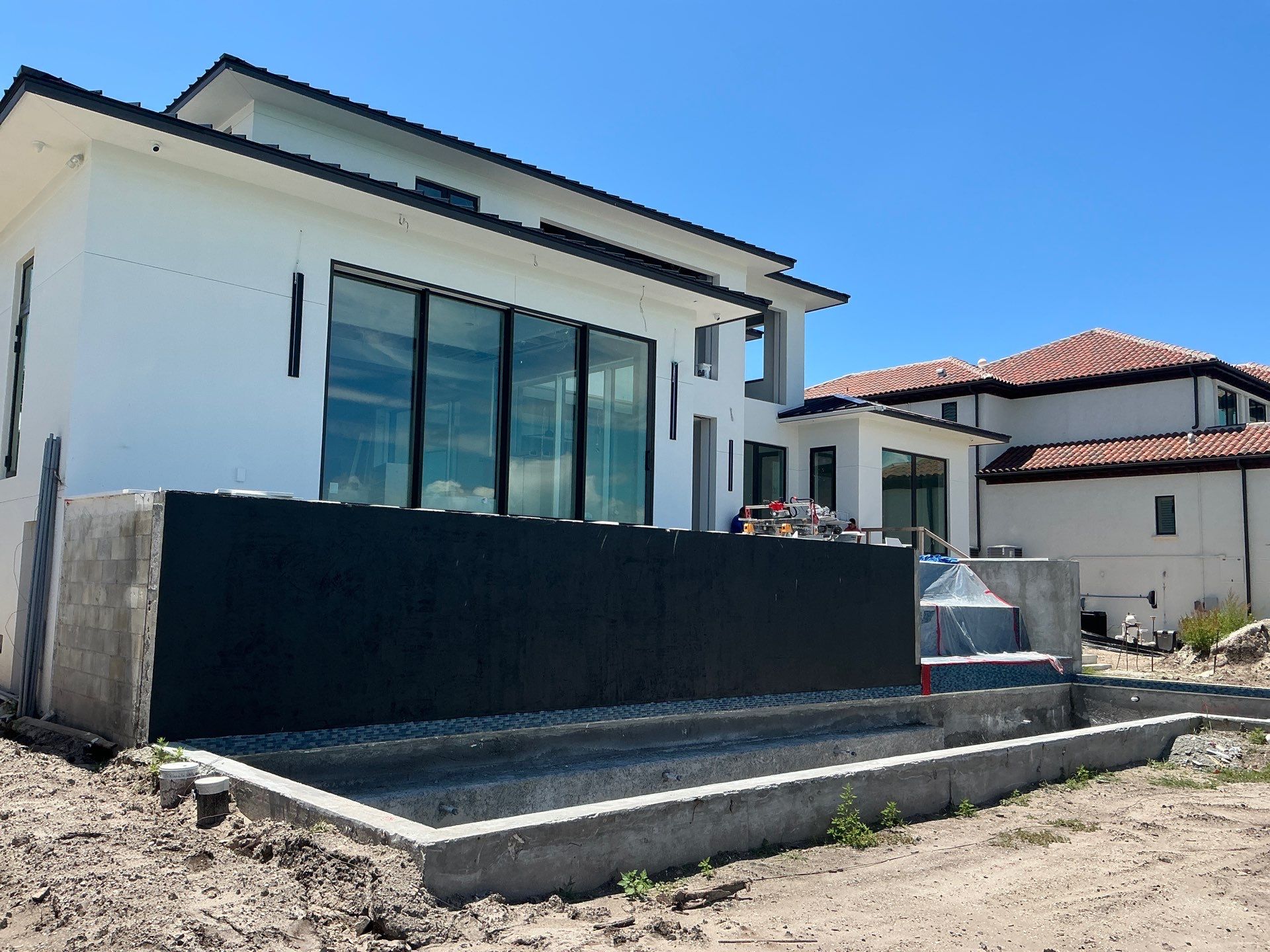 Seamless Aluminum Gutter Installation using black seamless gutters in Sarasota FL by Gutter Professors