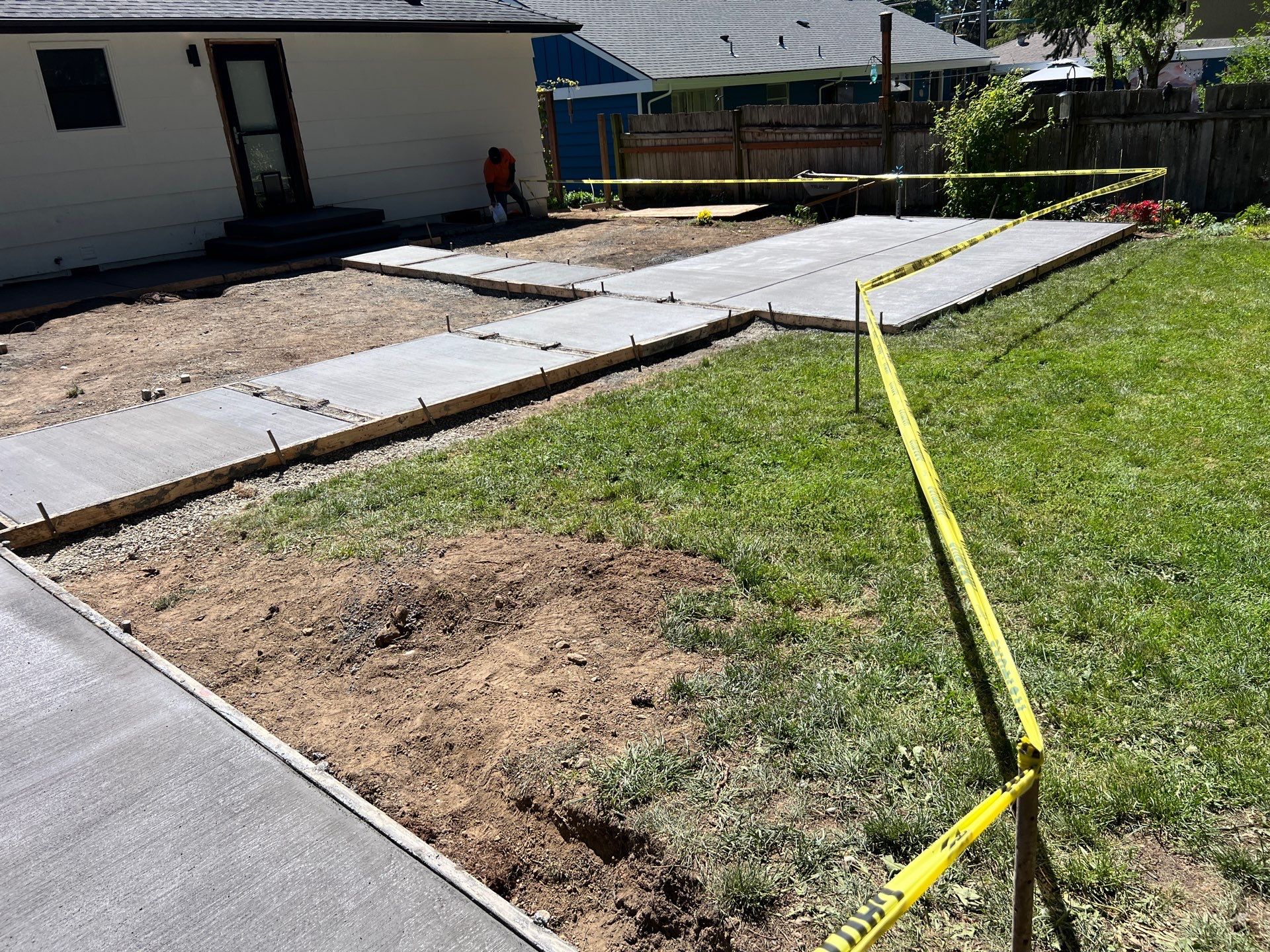 John | Concrete Backyard Walkway by Jireh Asphalt & Concrete Inc 