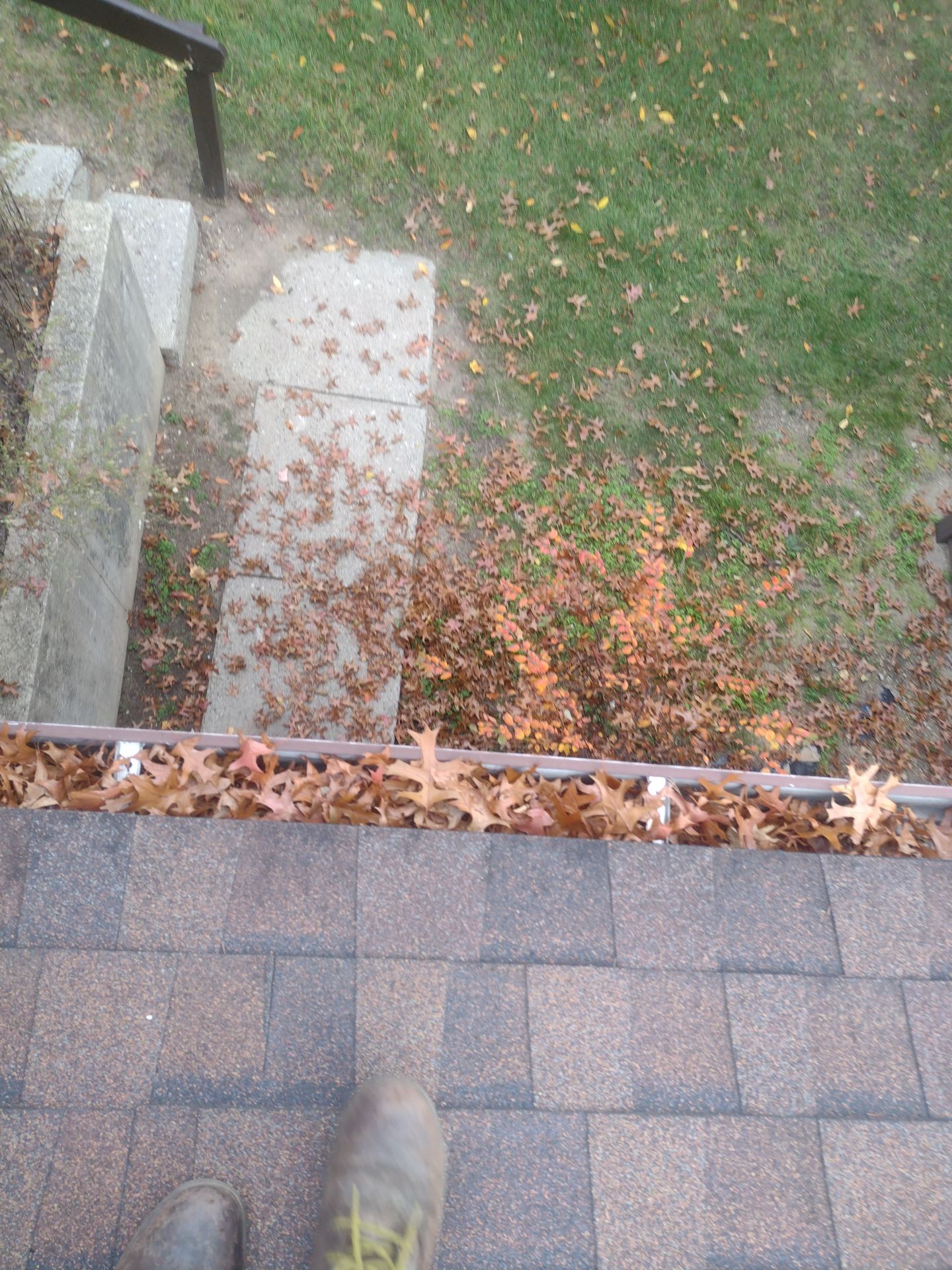 Commercial gutter cleaning Battle Creek, MI before photo with filled gutters