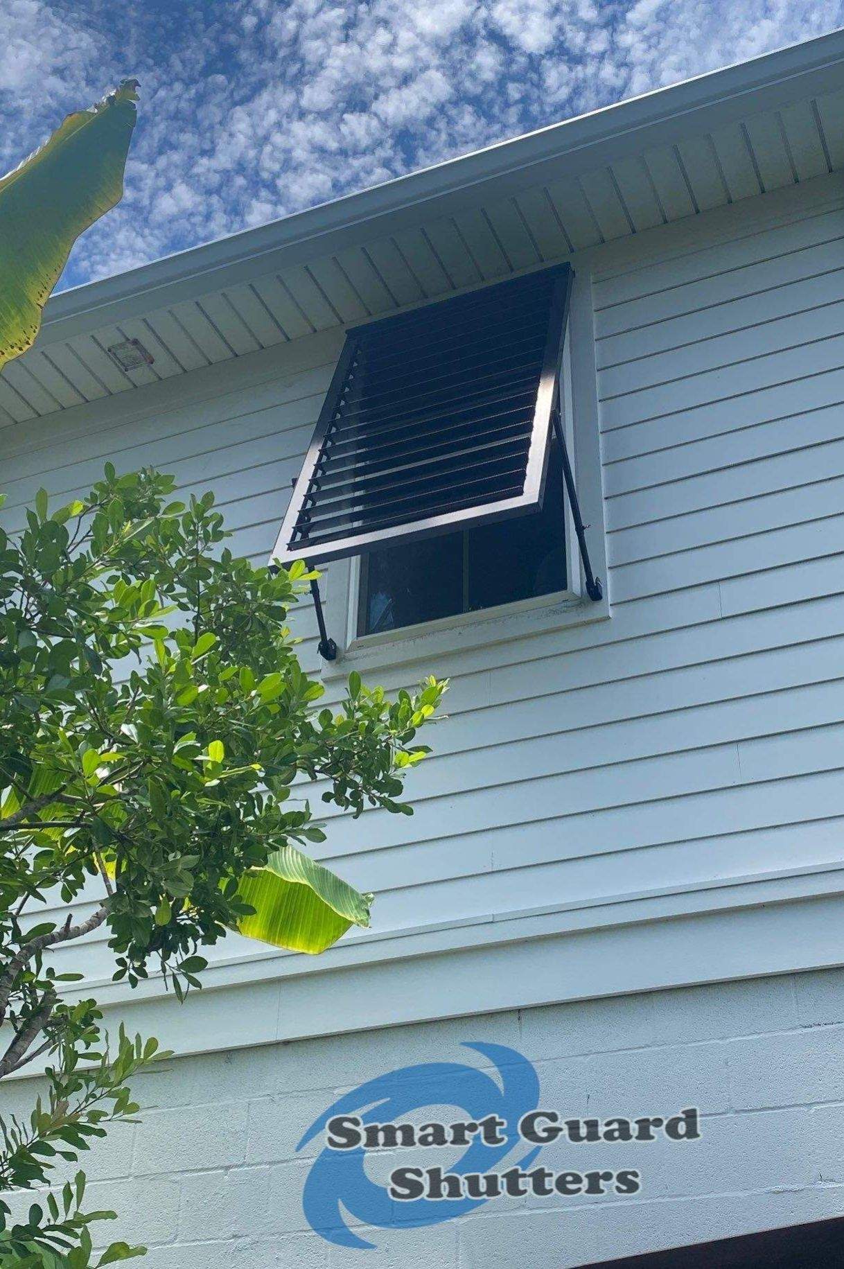 Impact Bahama Shutters in Jet Black by Smart Guard Shutters