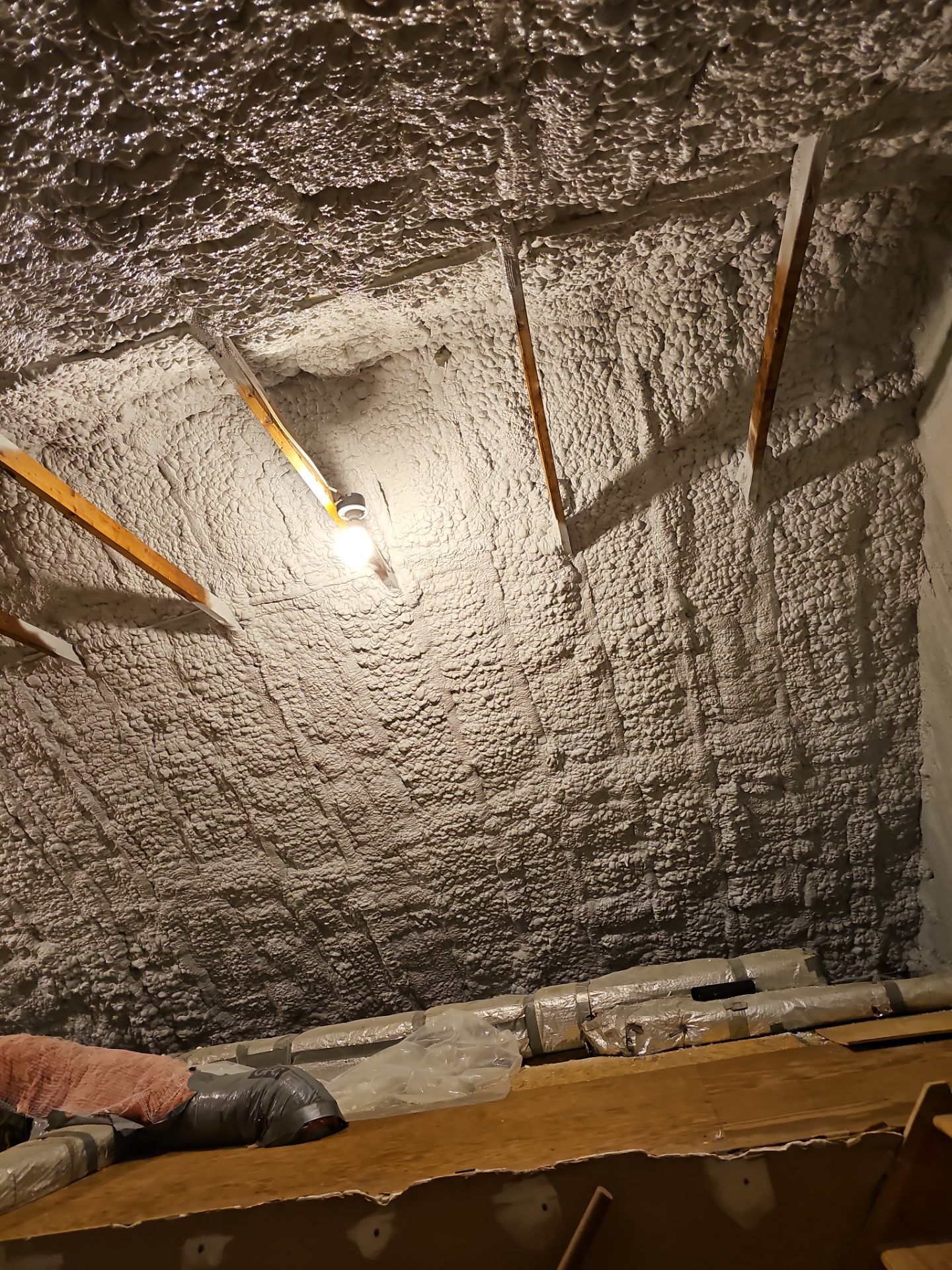 Attic Retrofit using open cell spray foam by NYS Foam & Energy