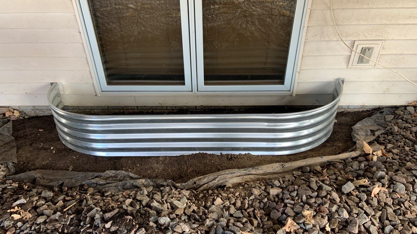 Basement Window Well & Drainage Board in Maple Grove, MN by Waterproofing Northeast