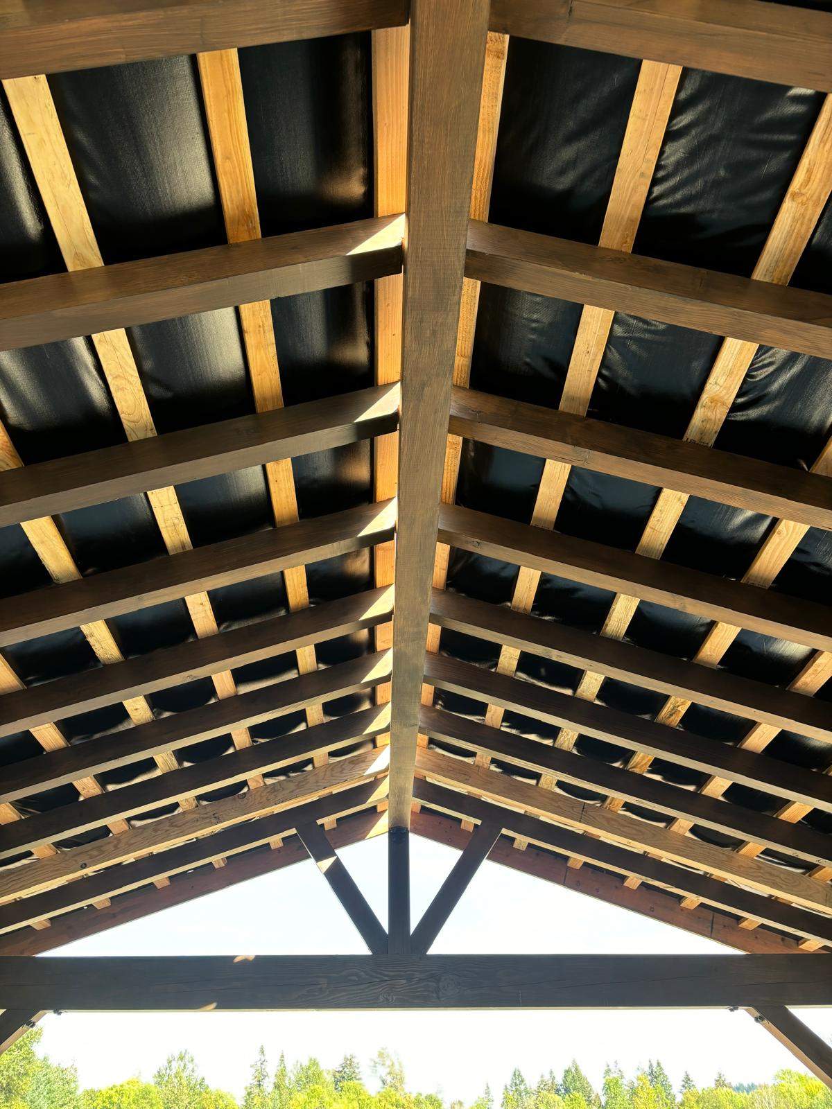 Custom Timber Frame Patio Cover with Black Metal Roof by American Made Construction