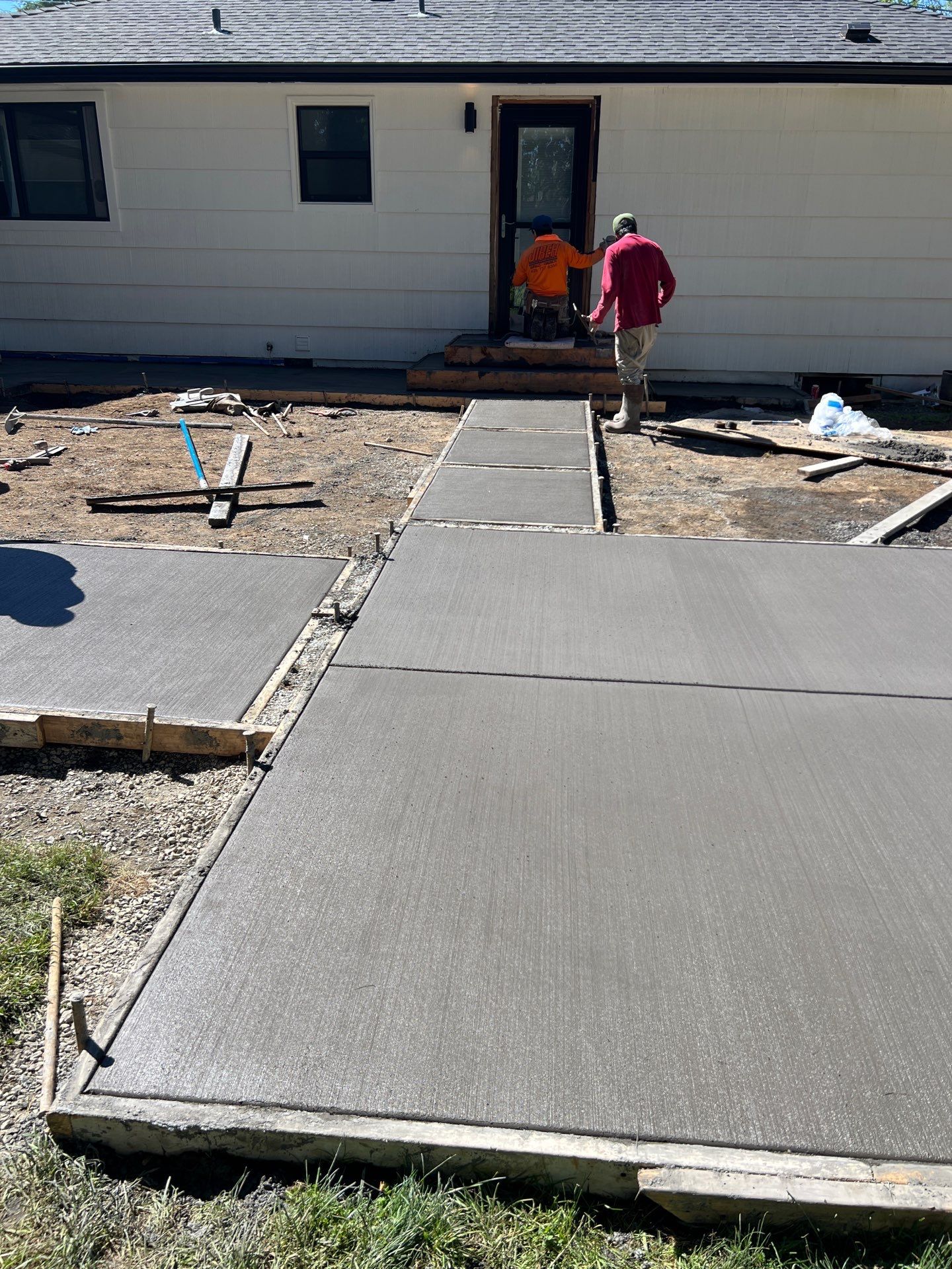 John | Concrete Backyard Walkway by Jireh Asphalt & Concrete Inc 