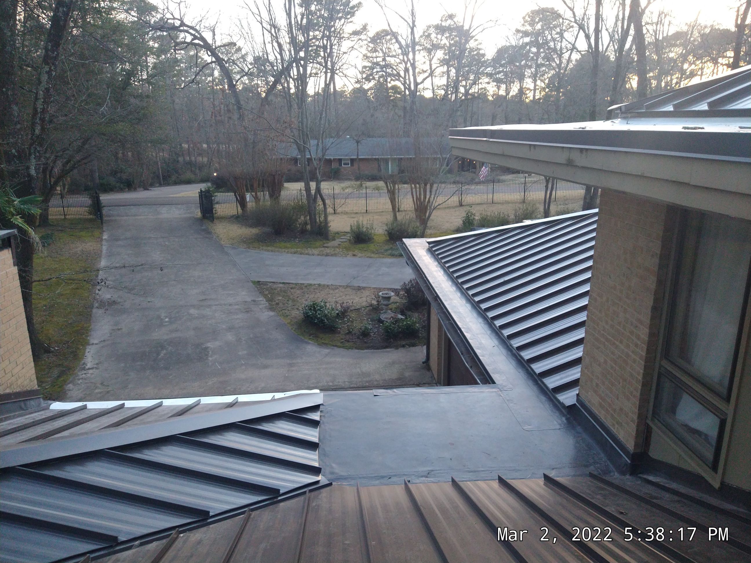 Residential Roofing Installation using PVC membrane and 24 gauge Standing Seam Metal by Hostetler Roofing