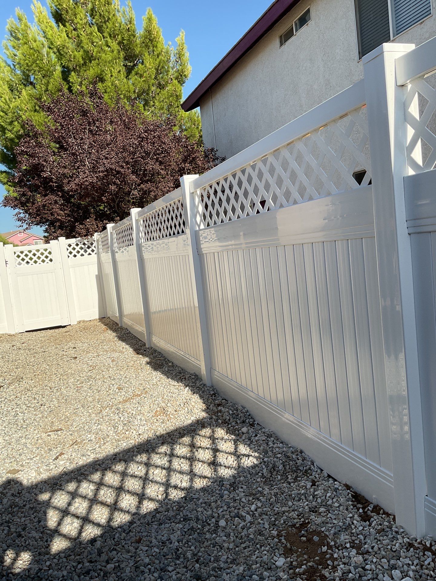 Lattice Vinyl with Privacy Vinyl Fence by Fence Guys Inc.