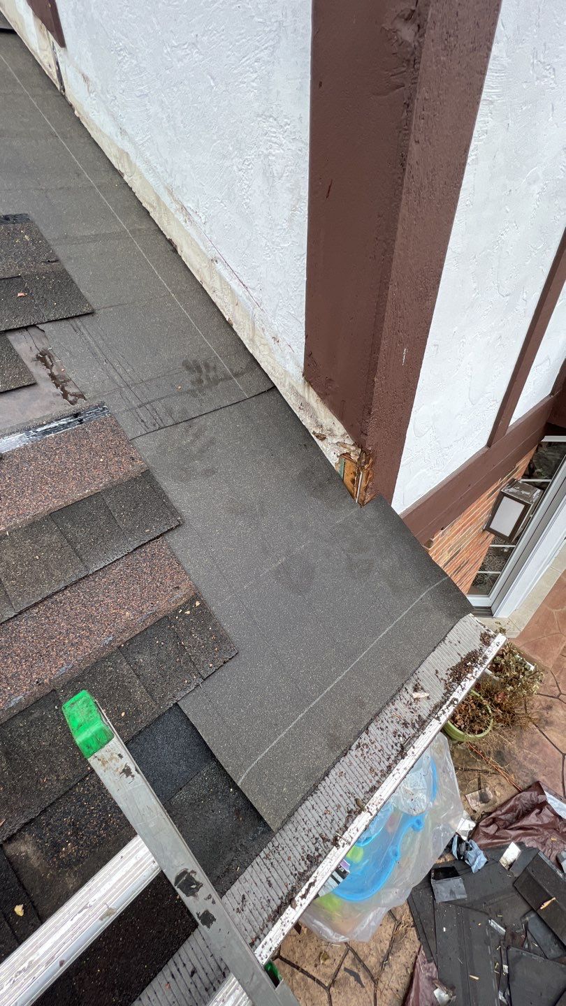 Step flashing repair on roof to wall by Pro Home Services Inc