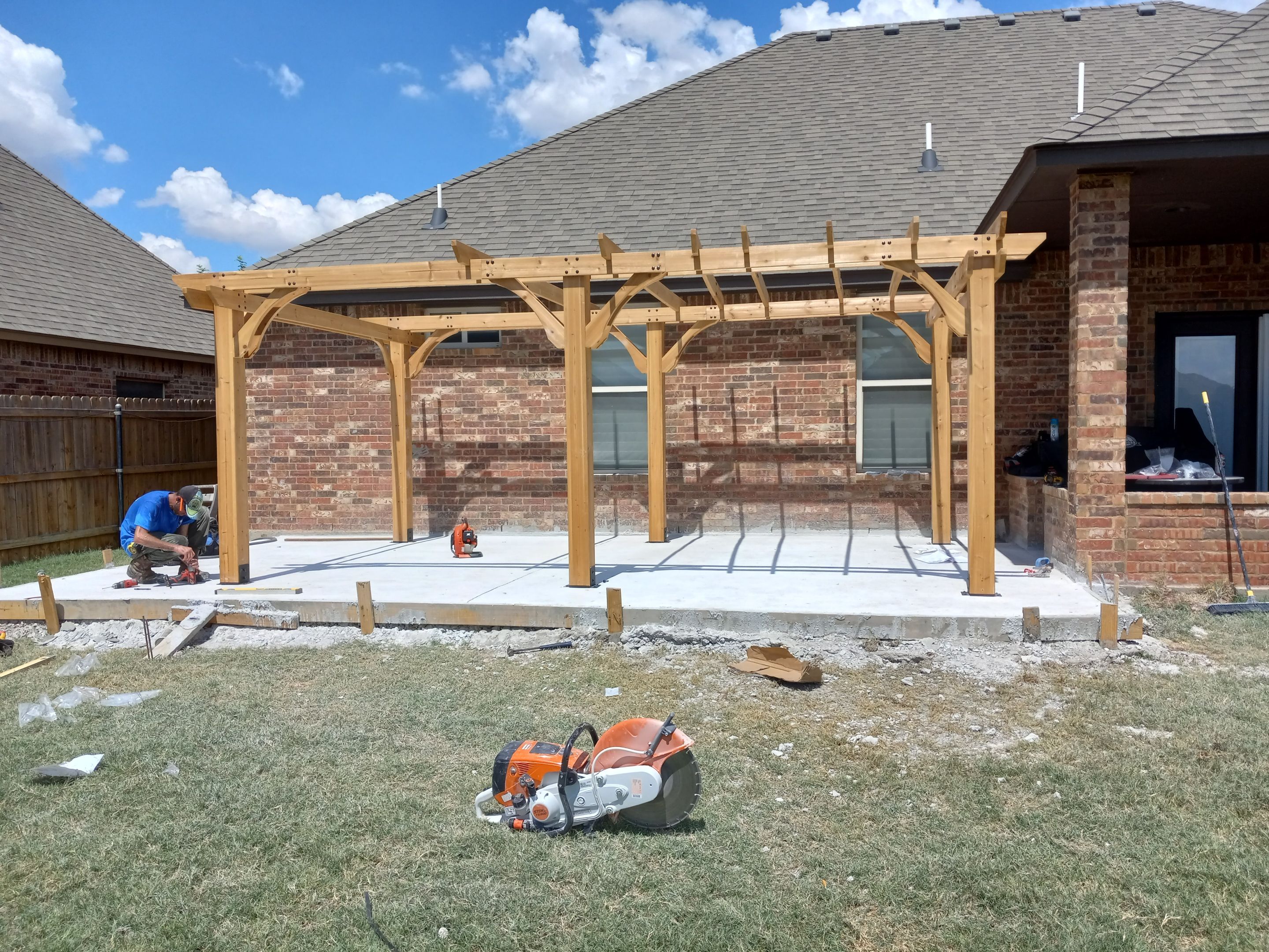 Concrete slab with Pergola by Clays Services Inc